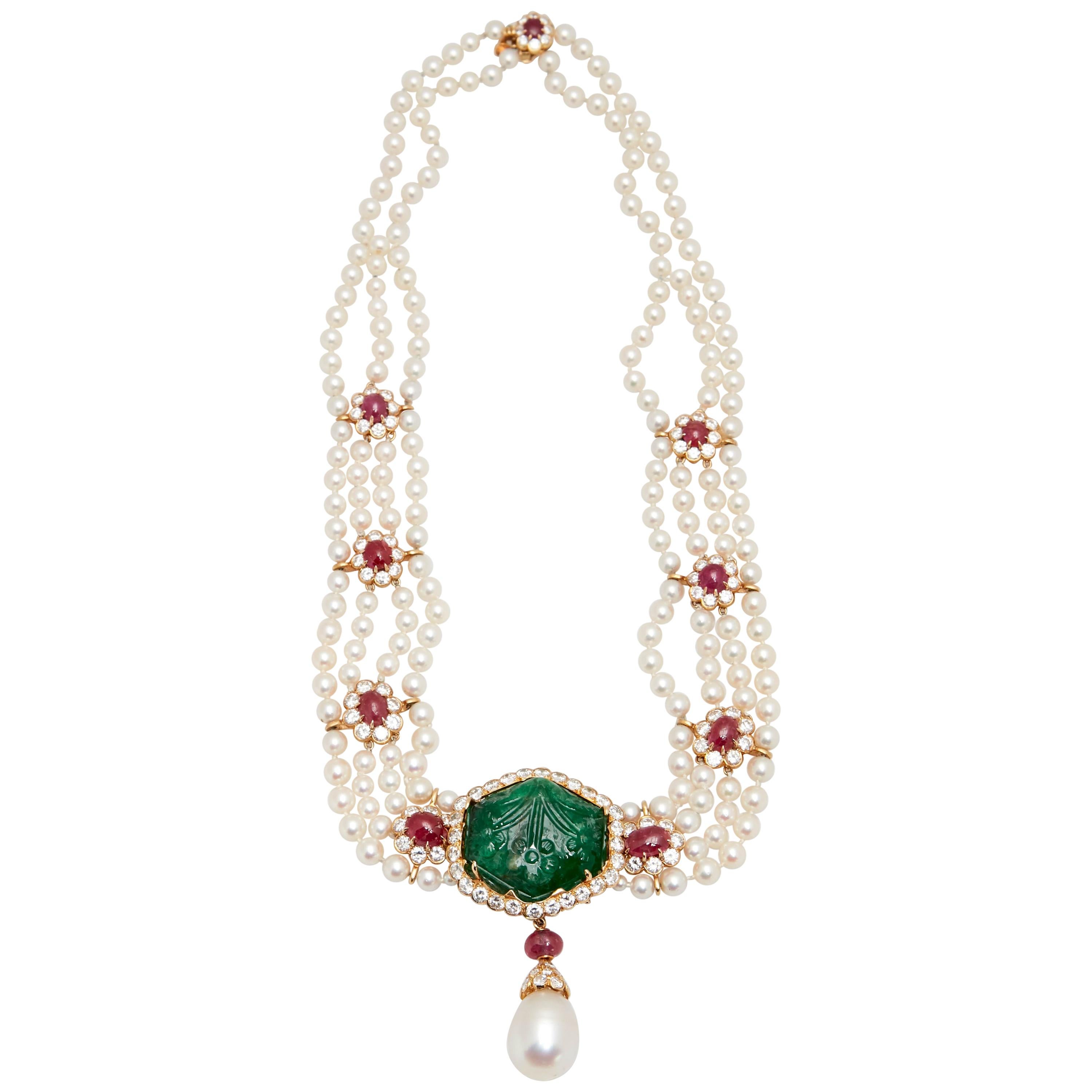 Collectable Van Cleef & Arpels four strand pearl, carved emerald, cabochon ruby, and diamond pendant-necklace, circa 1965. 

The double strand continuing to four strands of pearls approximately 4.8 to 4.0 mm., spaced by 8 oval cabochon rubies,