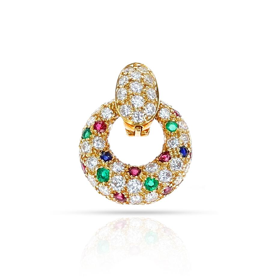 A Van Cleef & Arpels Emerald, Ruby, Sapphire and Diamond Pendant made in 18 Karat Yellow Gold. The total weight of the pendant is 4.88 grams. The length is 0.60