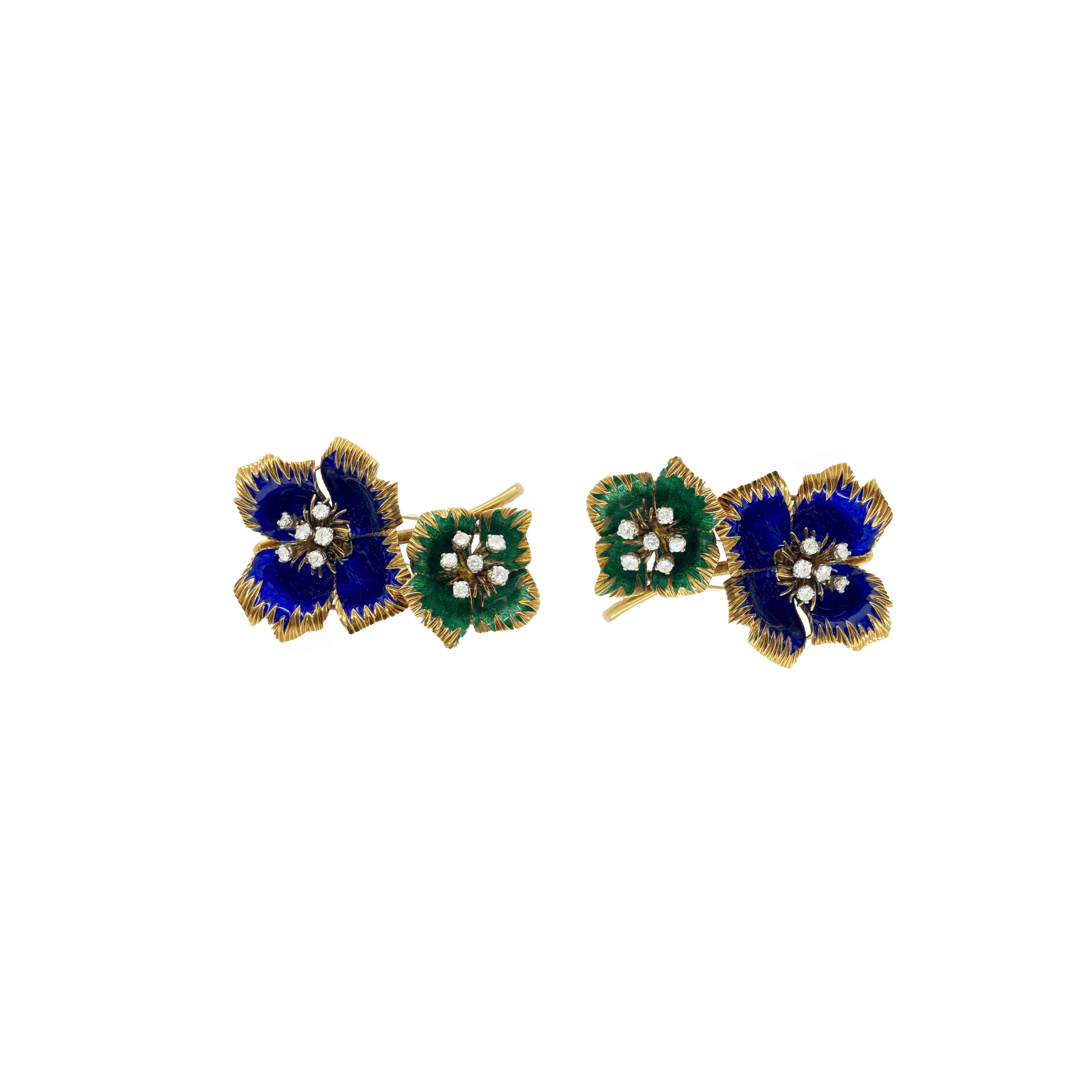 A chic pair of enamel and diamond flower brooches by Van Cleef & Arpels in 18 karat yellow gold. Circa 1960s.