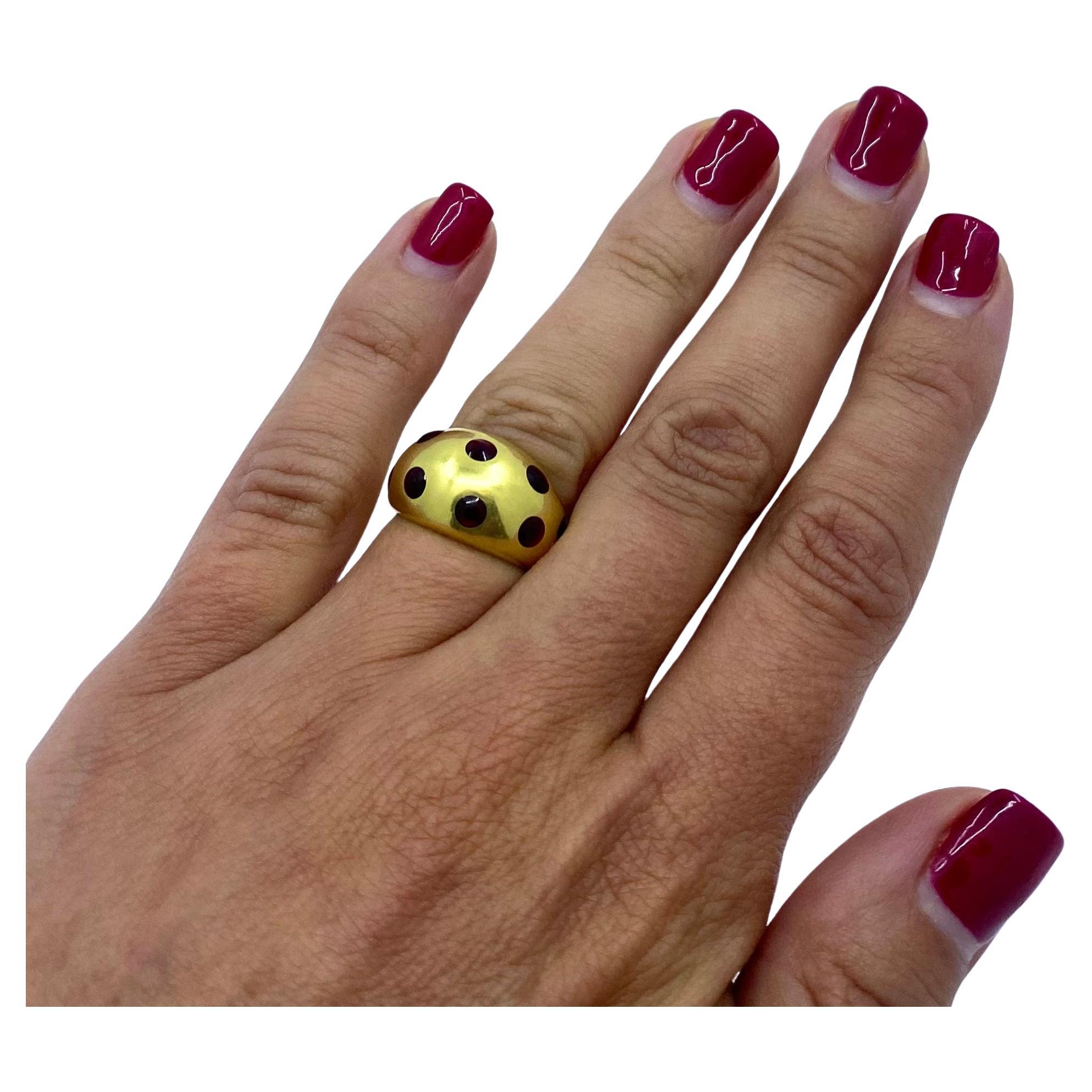 
A vintage dome ring by Van Cleef & Arpels, made of 18k gold, features enamel. The enamel drops are mount-flush set into the gold which creates a fun polka dot pattern on the ring. Along with the dome shape, it conveys a sweet, yet elegance feel for
