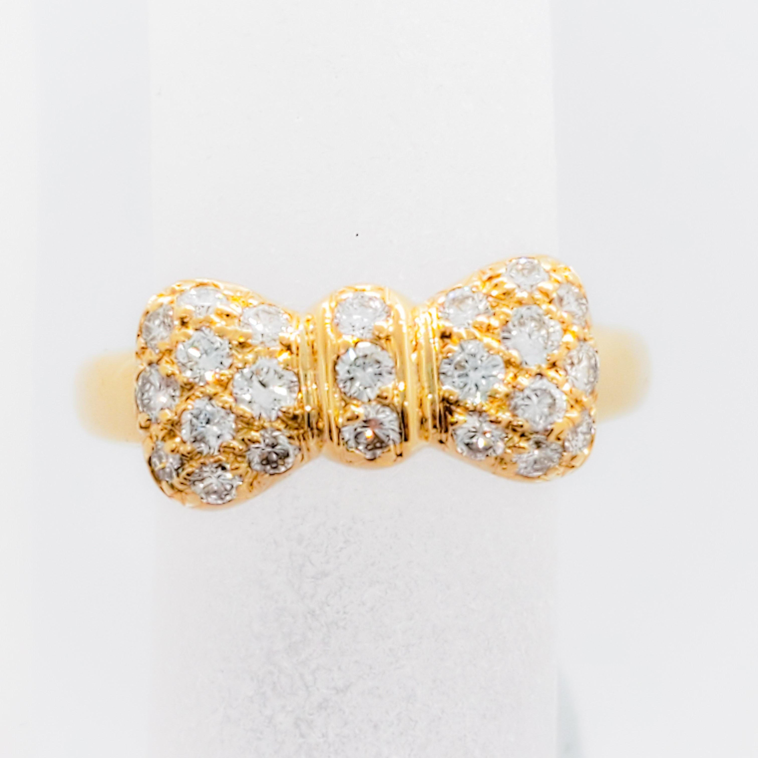 Gorgeous estate diamond ring from designer Van Cleef & Arpels.  This ring is made with 0.18 cts of good quality, white, and bright diamond rounds in a bow design.  Size 5.  Excellent condition.