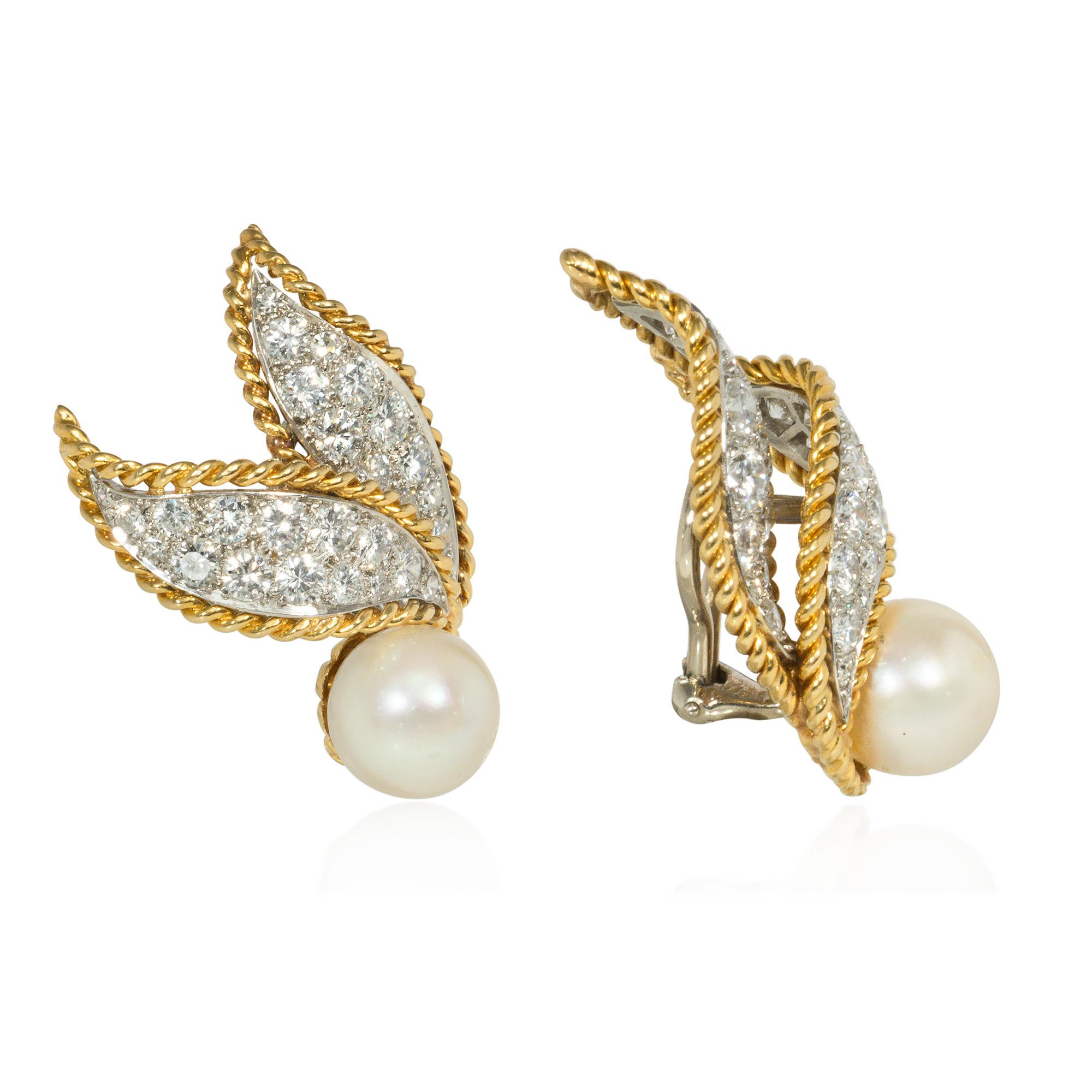 A pair of gold, diamond, and pearl clip earrings, each in the form of two juxtaposed pavé diamond curled leaves with gold rope twist borders and a pearl accent, in 18k and platinum.  Van Cleef & Arpels, #24751.  Atw diamonds 3.25 cts., 
E-F color