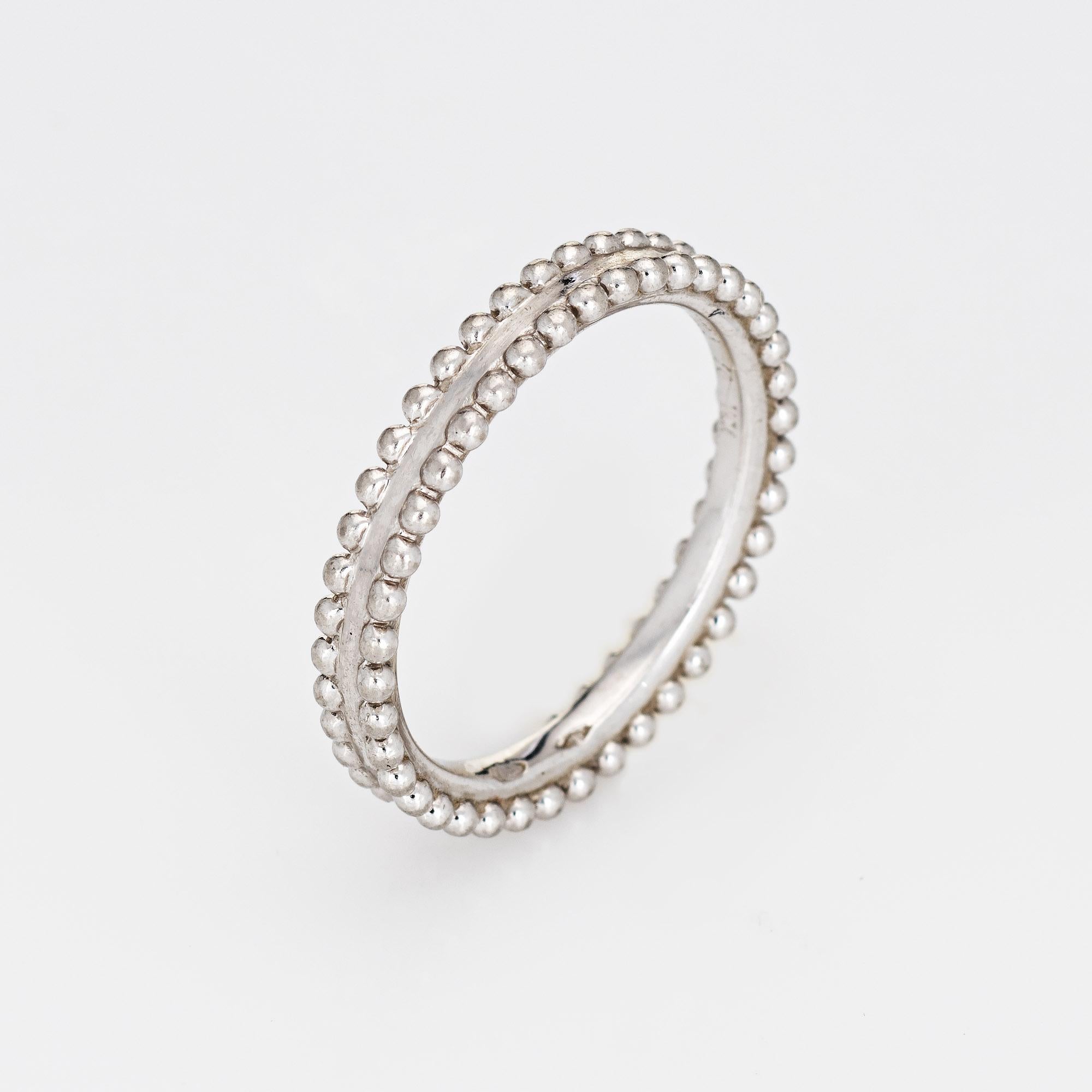 Pre-owned Van Cleef & Arpels 'Estelle' ring crafted in 950 platinum (circa 2000s).  

The Estelle ring is a celebration of its founder and first female figure, Estelle Arpels. The ring is delicately edged with platinum beads and emphasizes the