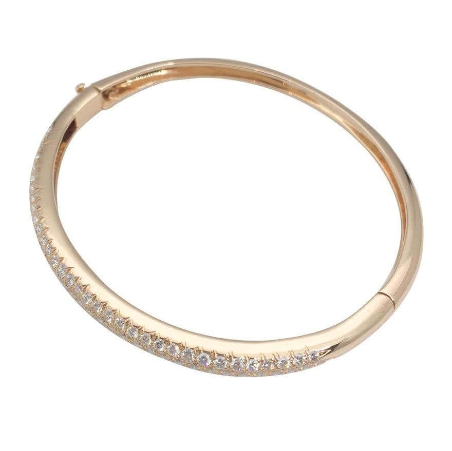 18k yellow gold  bangle bract encrusted with tree rows of diamonds with total weight of 2,50 carats 
With the makers hallmark and signed VCA