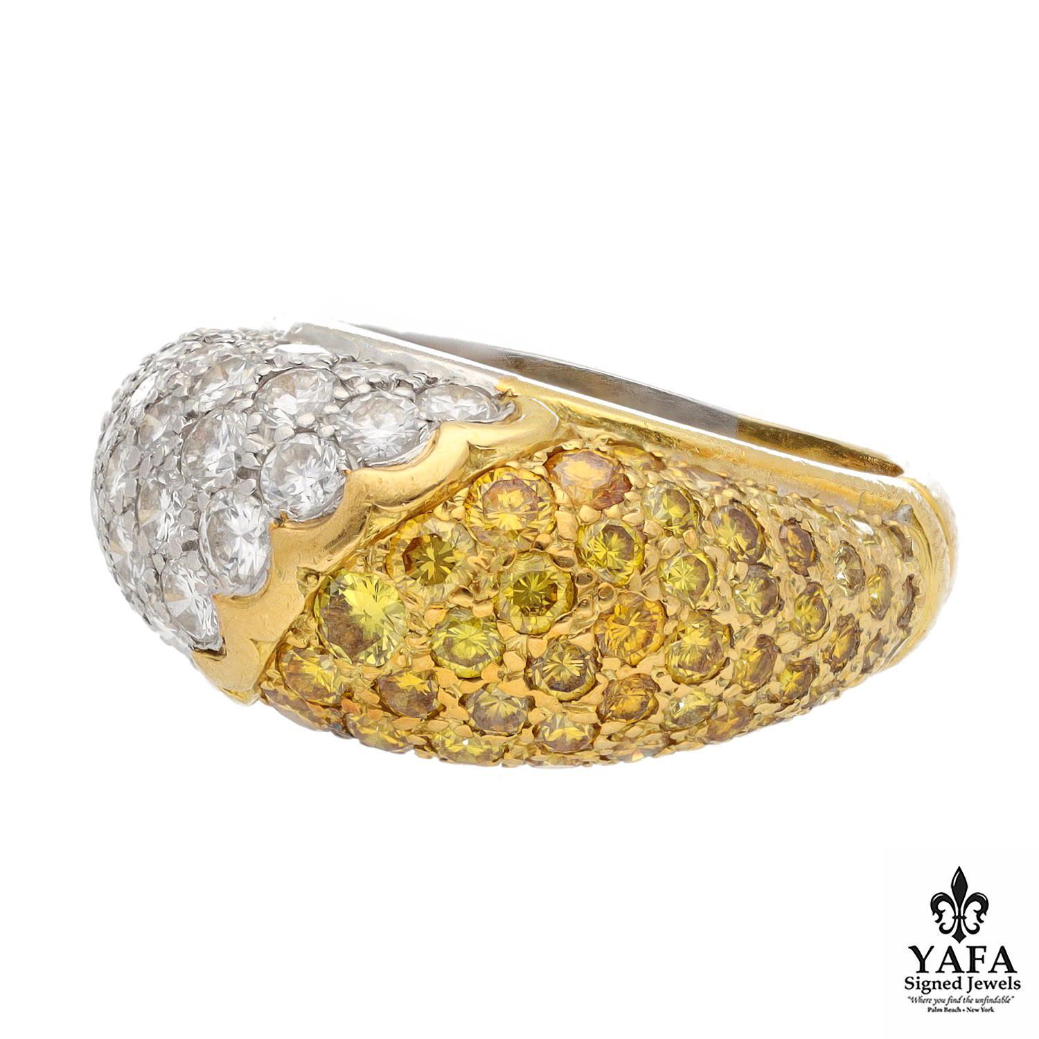 Fancy Yellow and White Diamonds Each Take Center Stage in this Bombe Style Ring. The Unique Split Metal Shank is in Platinum and 18K Yellow Gold.

Signed - Van Cleef & Arpels NY