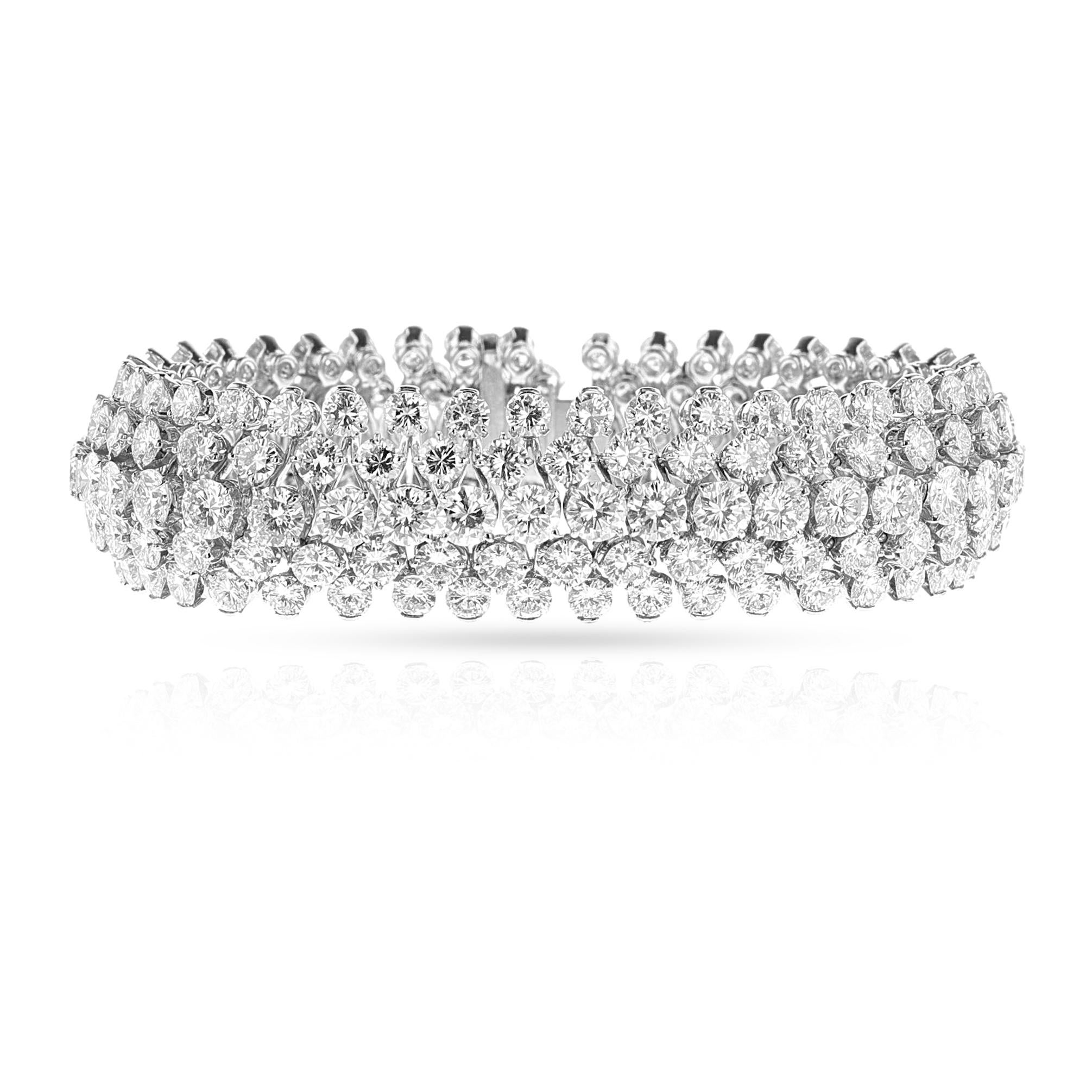 A Van Cleef & Arpels Five Row Diamond Bracelet made in Platinum and 18k white gold. The length of the bracelet is 7 inches long and 0.72 inches wide, weighing 78.90 grams. Signed and numbered with French assay marks and maker's marks.The diamonds
