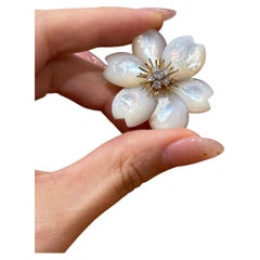 Van Cleef & Arpels “Fleur de Noël” Mother-of-Pearl and Diamond Brooch in Gold
