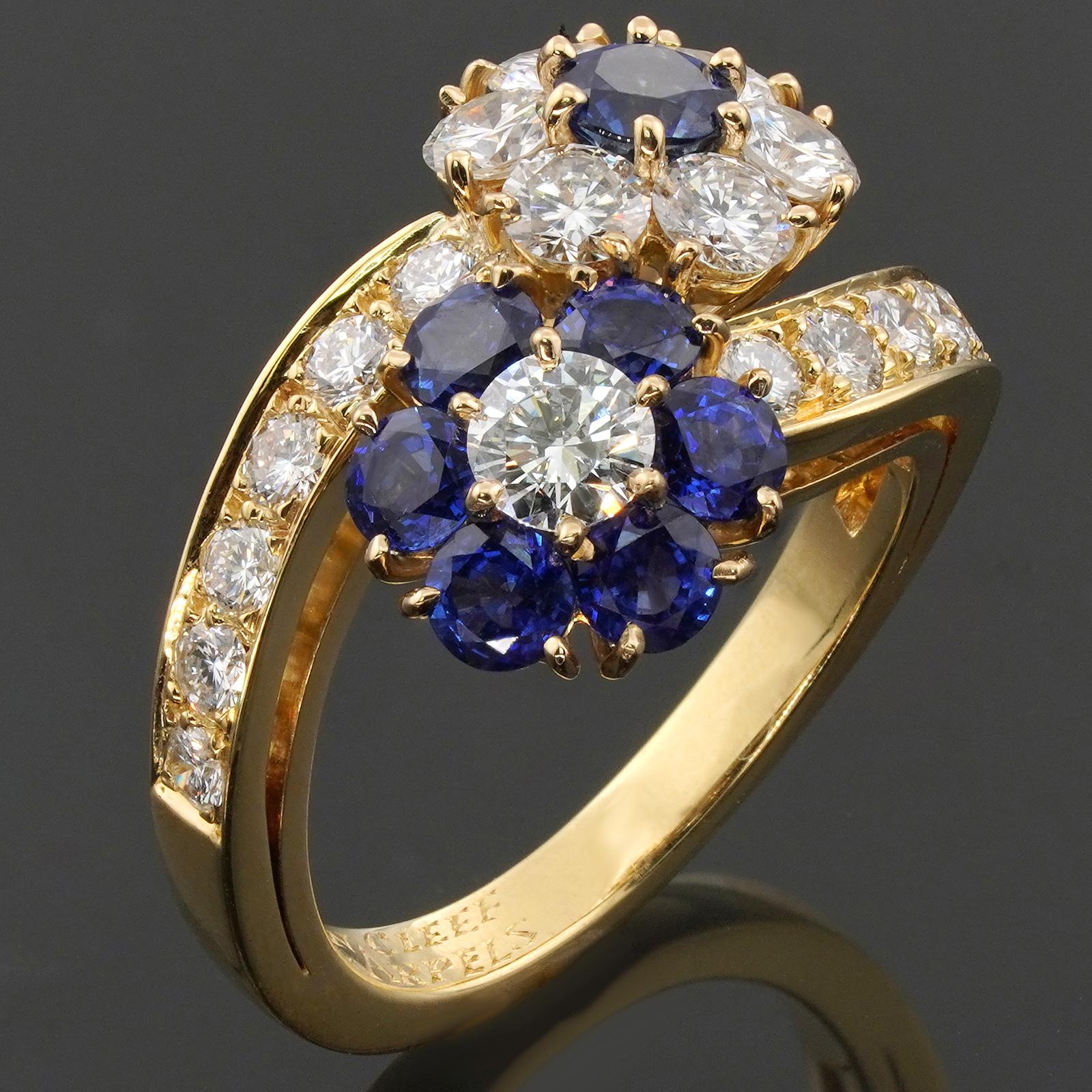 This gorgeous Van Cleef & Arpels ring from the exquisite Fleurette collection features a double flower design crafted in 18k yellow gold and set with round blue sapphires and brilliant-cut round E-F-G VVS1-VVS2 diamonds. Made in France circa 1980s. 