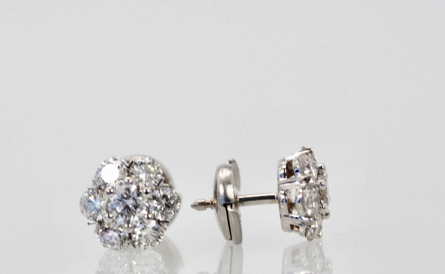 These gorgeous VCA Earrings are as classic as it gets.  This is the small model of Fleurette earrings currently retailing for $15,800.  These earrings have 14 stones, 7 stones each of DEF color Diamonds with a IF to VVS clarity range.  These stones