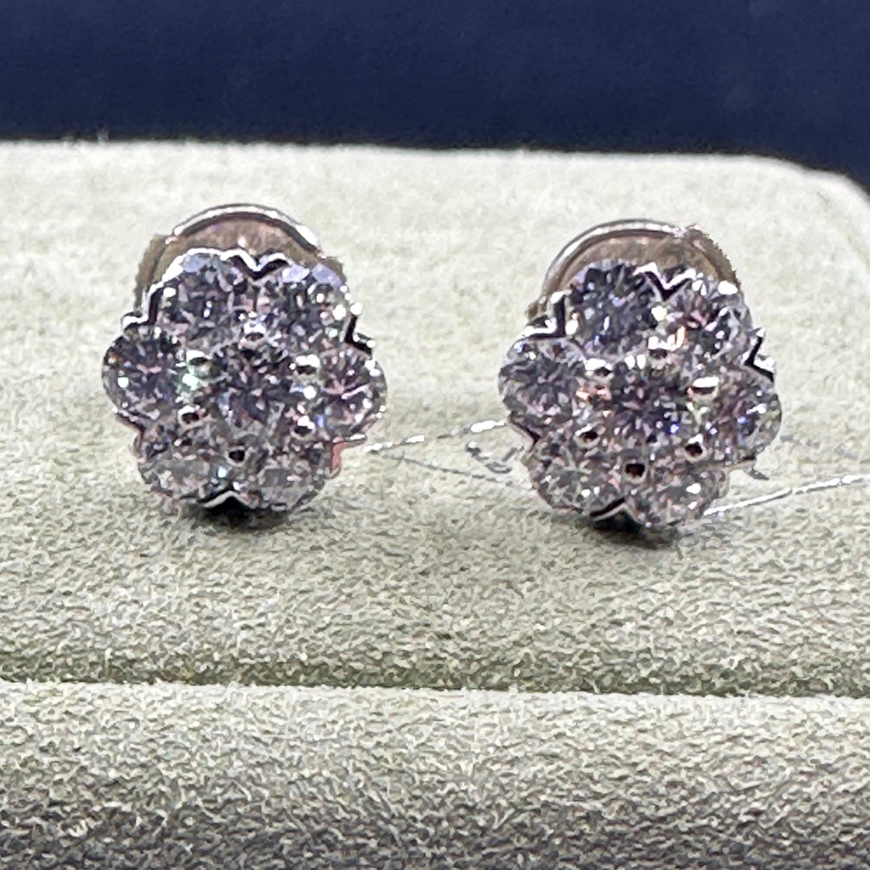 VCA FIEURETTE Large Diamond Studs 1.94 cts tw set in 18k White Gold . 14 round brilliant cut diamonds color grade D and clarity Vvs ref:VCARA48300 Serial BLXXXXX
PURCHASED 2006 .
From the VCA website : Fleurette earrings, rhodium plated 18K white