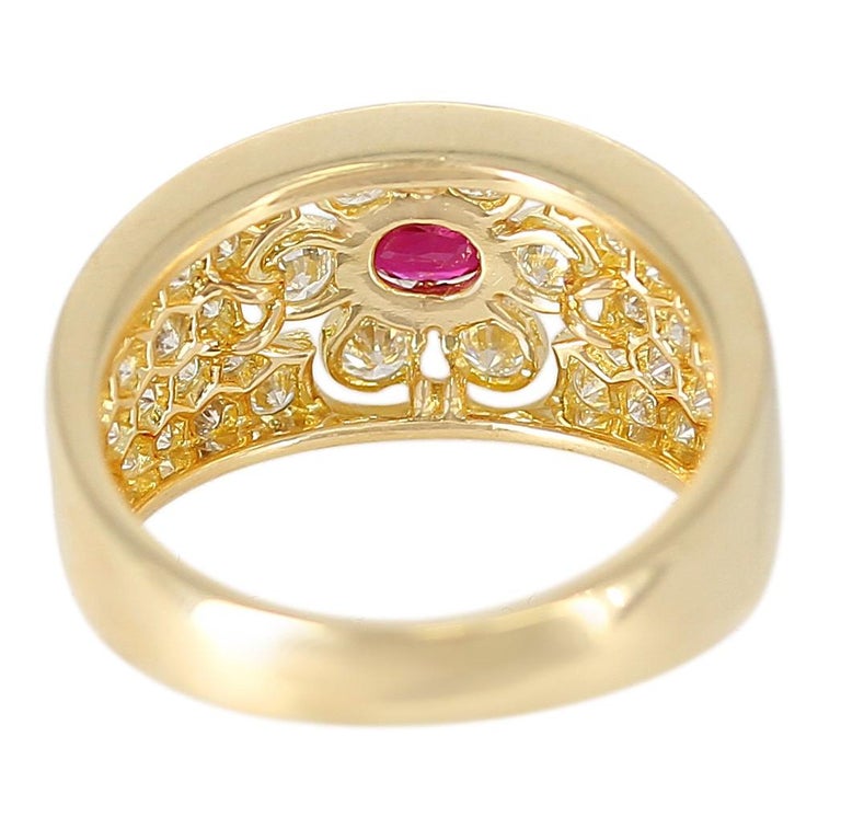 A Van Cleef and Arpels Floral Ruby and Diamond Ring in 18 Karat Yellow Gold with an Original VCA Box. Total Weight: 5.84 grams. Ring Size US 6. 
