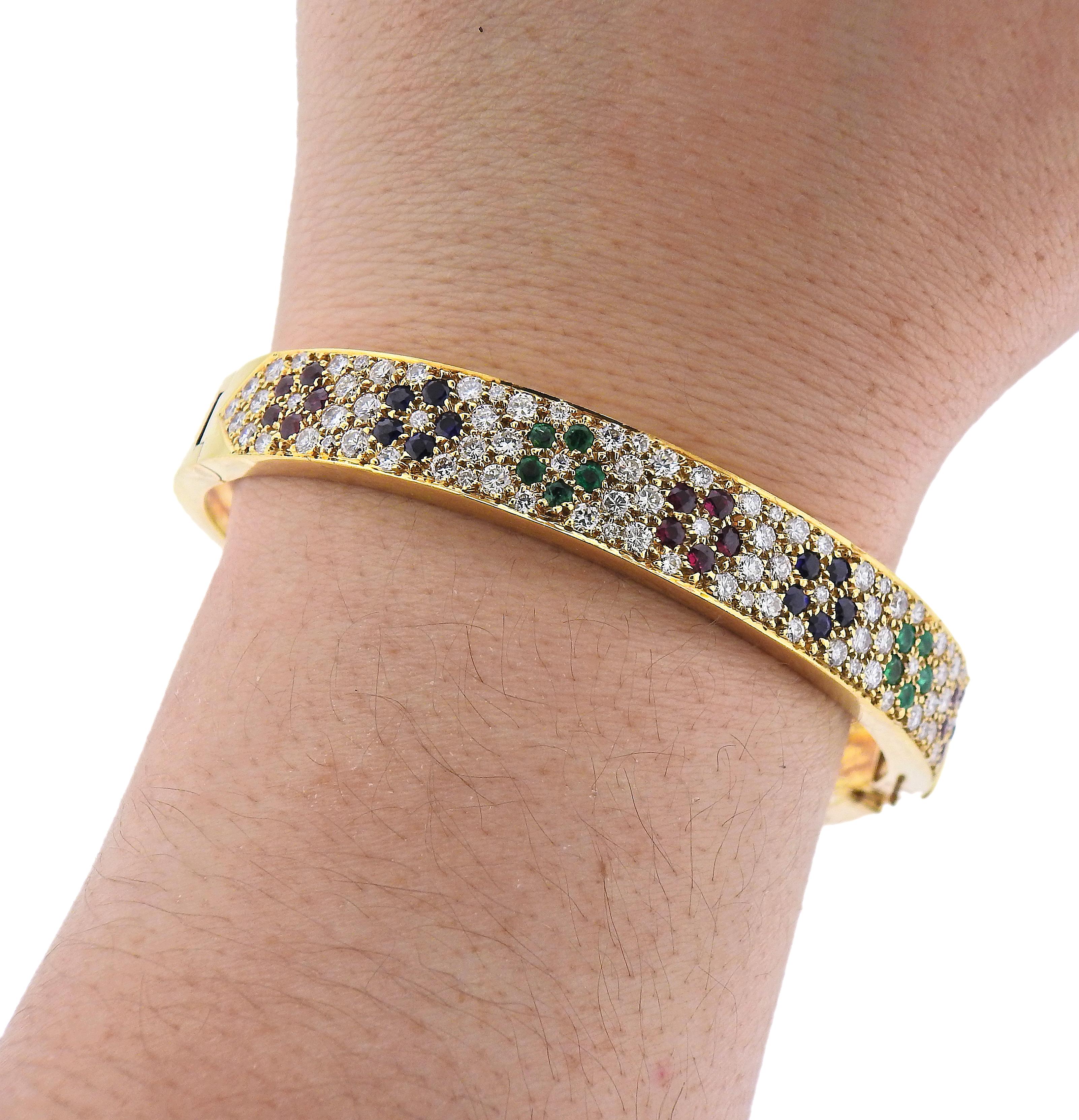 Van Cleef & Arpels Flower Emerald Sapphire Ruby Diamond Gold Bangle Bracelet In Excellent Condition For Sale In New York, NY