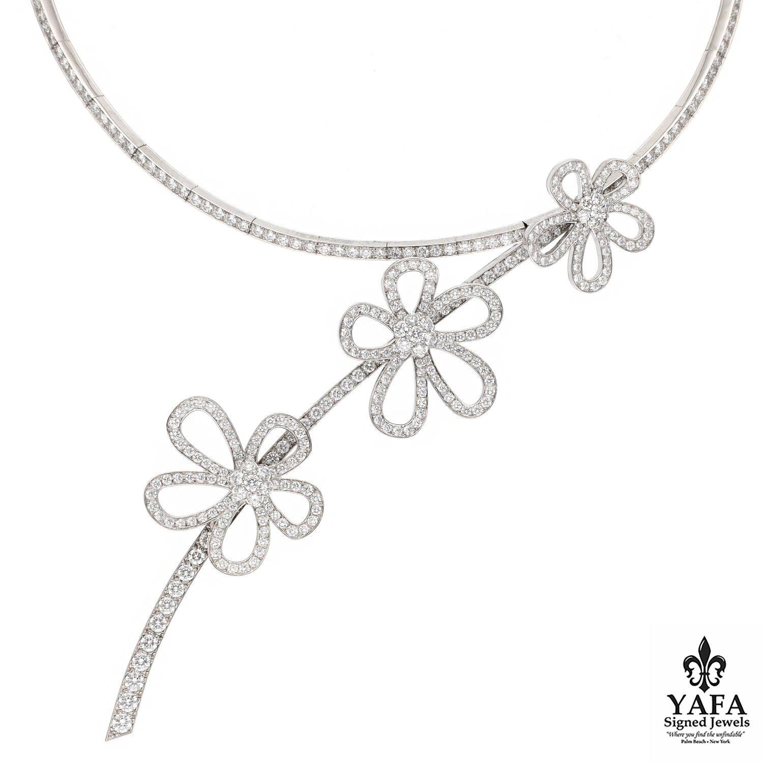 The Van Cleef and Arpels Flower Lace 18K White Gold and Diamonds Necklace is a stunning piece if jewelry know for its intricate design and craftsmanship. Featuring three delicate lace-like flowers as they cascade down the necklace adorned with
