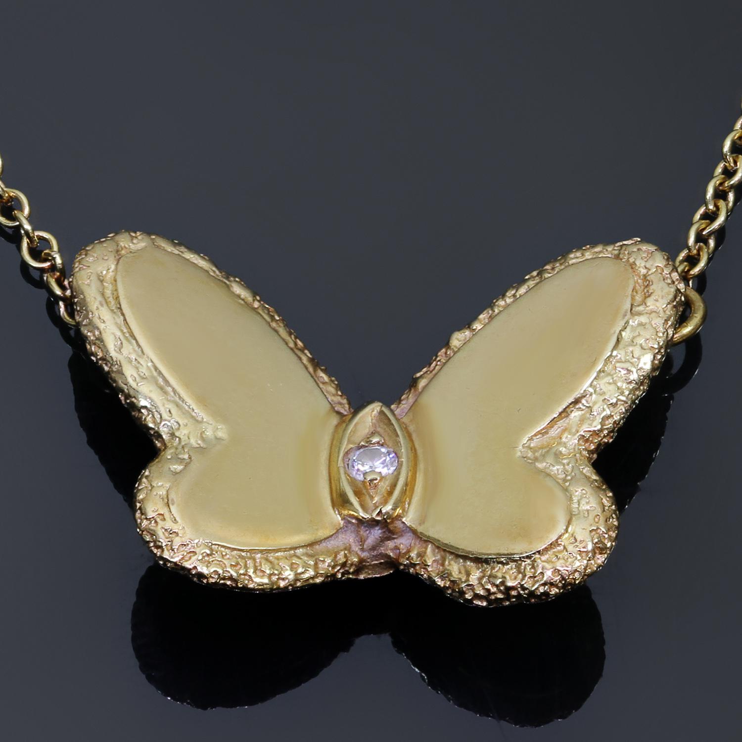 This rare and collectible vintage Van Cleef & Arpels necklace from the iconic Flying Beauties collection is crafted in textured 18k yellow gold and accented a solitaire brilliant-cut diamond of an estimated 0.03 carats. Made in France circa 1970s. 