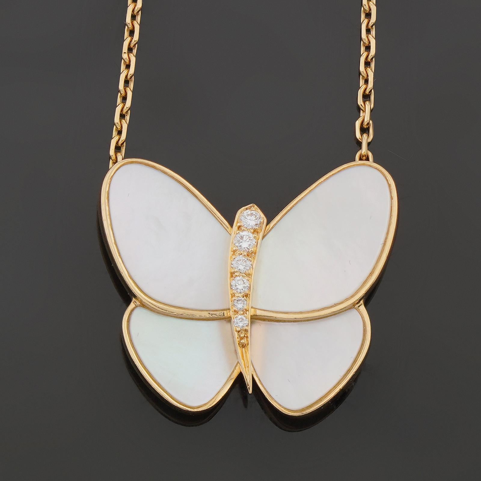 This graceful Van Cleef & Arpels necklace from the Flying Beauties collection is crafted in 18k yellow gold and features a butterfly pendant set with brilliant-cut round D-E-F VVS1-VVS2 diamonds and mother-of-pearl wings. Made in France circa 2013.