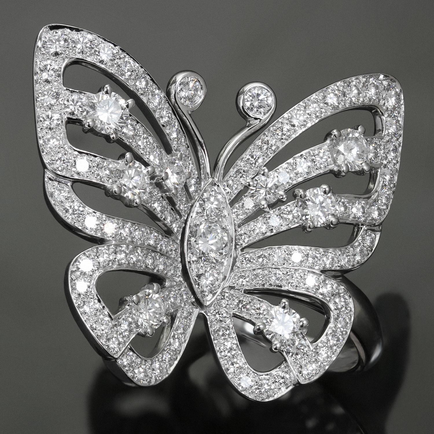 This spectacular Van Cleef & Arpels between-the-finger ring is crafted in 18k white gold and features a gorgeous flying butterfly design set with brilliant-cut round D-F VVS1-VVS2 diamonds weighing an estimated 3.11 carats. Made in France circa