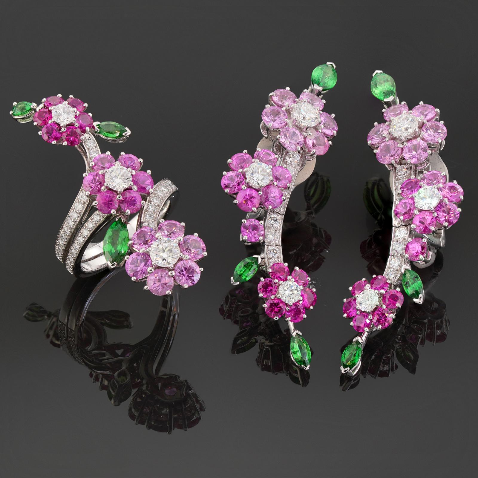 This impressive Van Cleef & Arpels clip-on earrings and ring Demi-Parure set from the floral Folie des Près is crafted in 18k white gold and set round pink sapphires, marquise tsavorite garnets and brilliant-cut diamonds. The sapphires weigh an