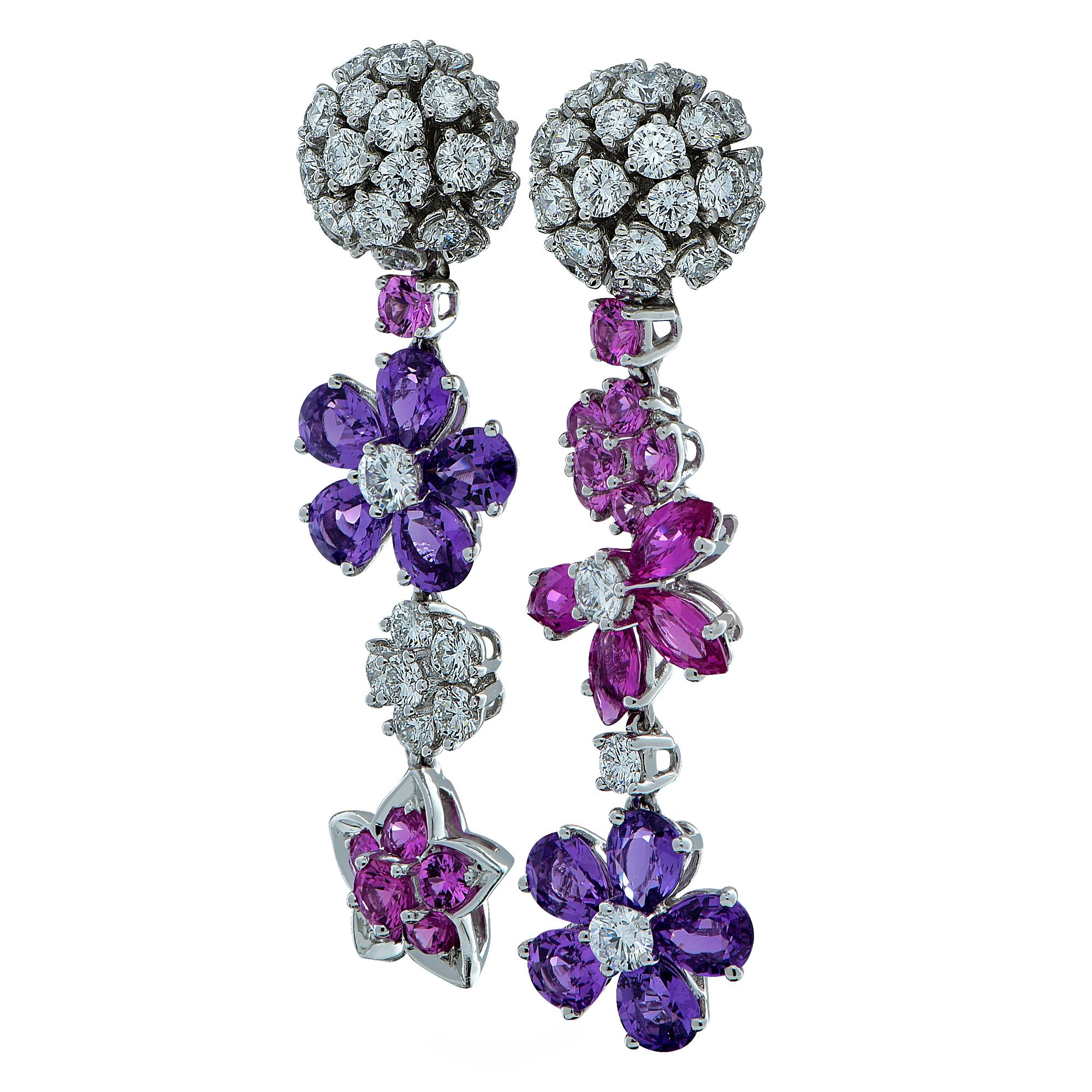 From the House of Van Cleef & Arpels, these exquisite Folie des Pres dangle earrings, finely crafted in 18 Karat White Gold, showcase 64 round brilliant cut diamonds weighing approximately 3.16 carats total weight, D-F color, IF-VVS clarity, and 28