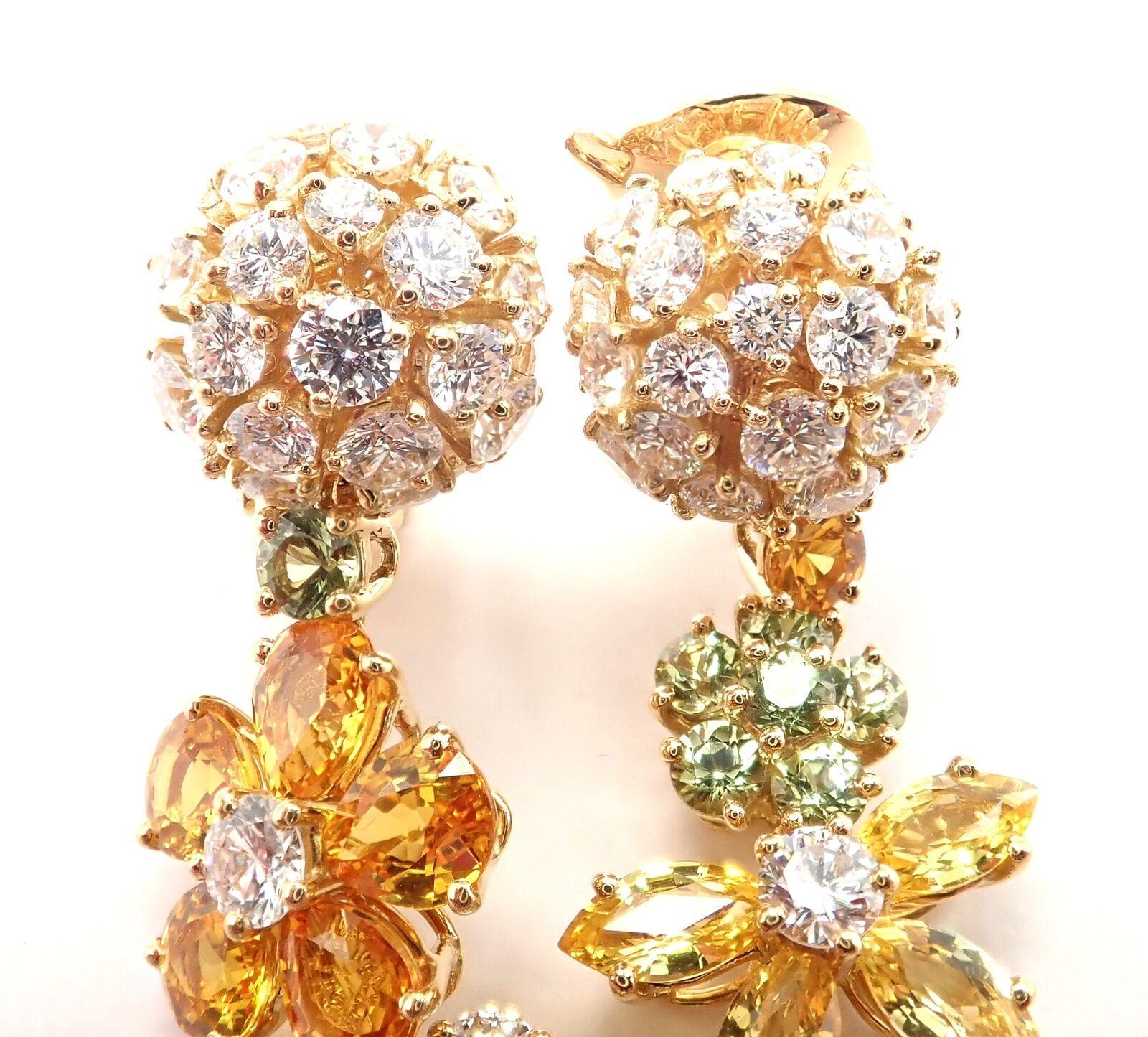 18k Yellow Gold Folies des Pres Diamond Yellow, Green, Orange Sapphire  Earrings by Van Cleef & Arpels.
With 64 round brilliant cut diamonds VVS1 clarity, E color total weight approximately 3.15ct
Round, Pear, Marque shapes Yellow, Green, Orange