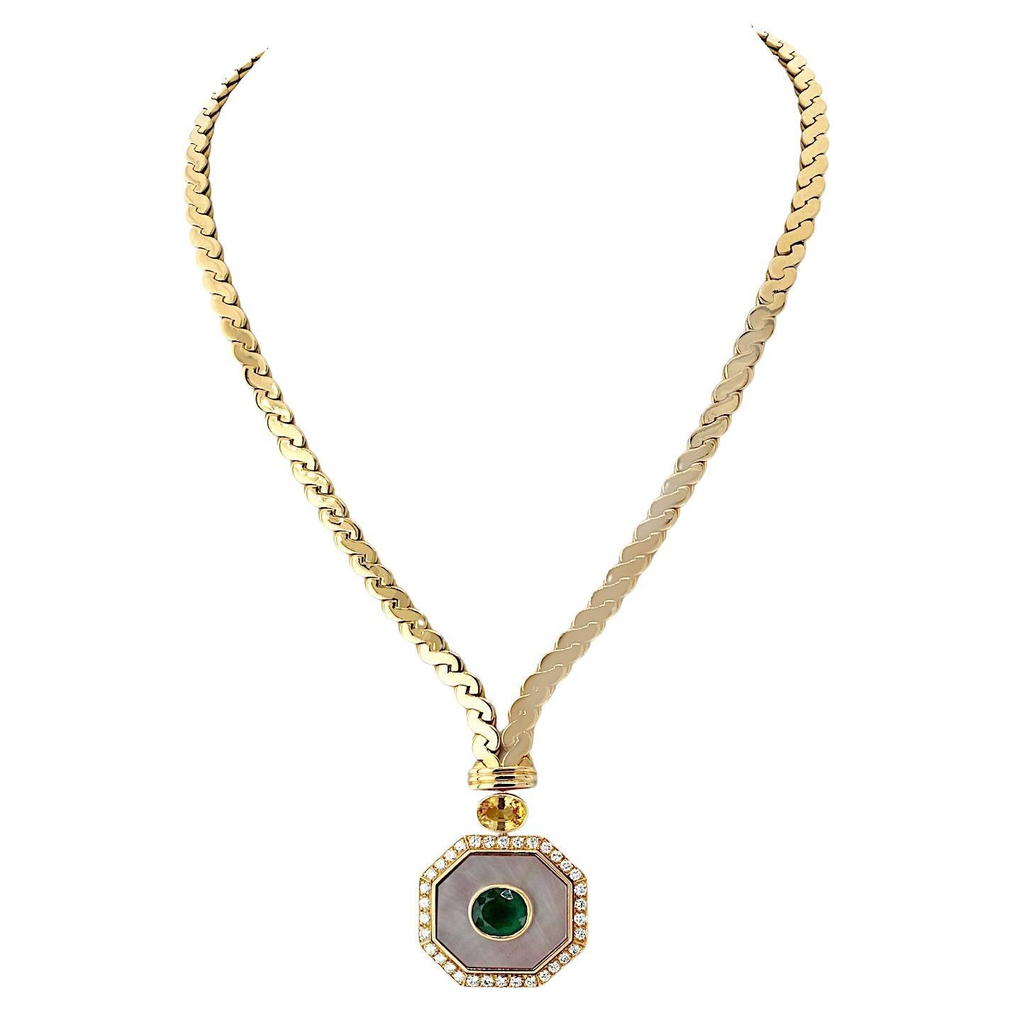 Van Cleef & Arpels 18K Yellow Gold Emerald, Yellow Sapphire, and Mother-of-Pearl Necklace is a rare and exquisite vintage masterpiece. 

This exceptional necklace features a beautifully crafted twisted rope flat chain in rich 18k yellow gold,