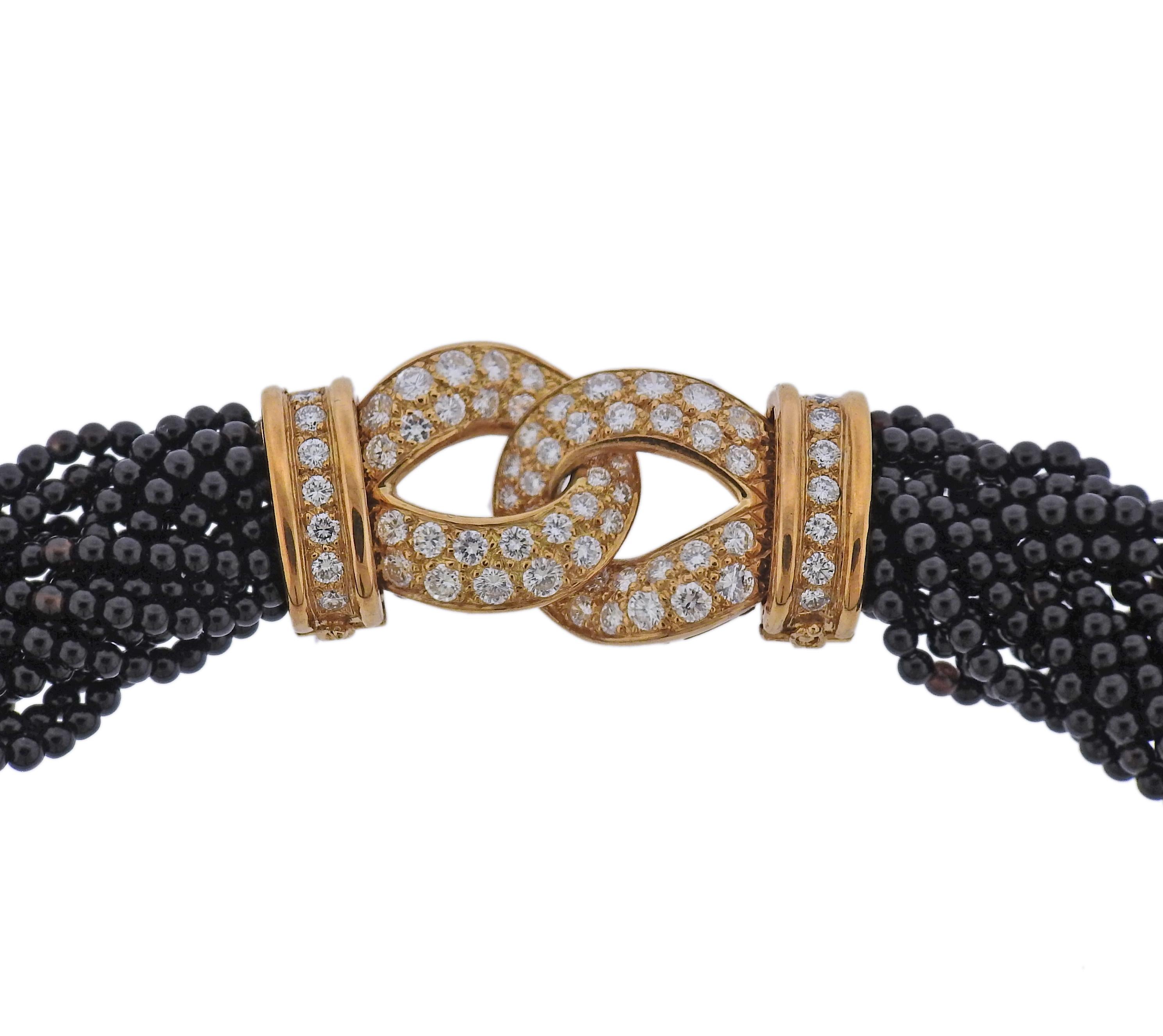 18k yellow gold braided necklace by Van Cleef & Arpels with onyx beads and 2.14ctw in VVS/F-G diamonds. Comes with VCA pouch and a copy of original Valuation report by VCA. Necklace is 15.25
