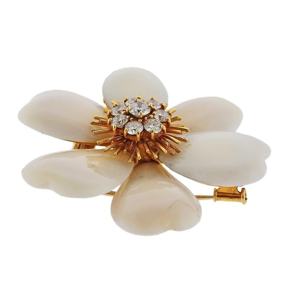 Large 18k yellow gold clematis flower brooch, crafted by Van Cleef & Arpels in France. Set with white coral petals (one ha s a fracture) and approx. 1.75ctw in diamonds.  Brooch is 52mm x 52mm. Marked; VCA, made in France, 750, Ny1K.103. Weight -