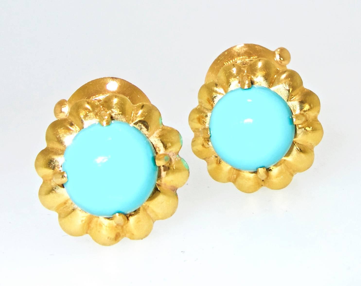18K fine earrings centering 10.5 mm. bright turquoise, these earrings are signed, numbered and hallmarked.  They are for either a pierced or a non pierced ear.  These earrings are .75 inches in diameter, circa 1960