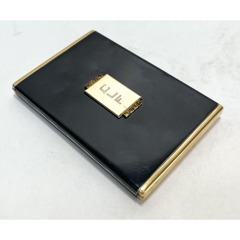 Van Cleef & Arpels Frencg Art Deco Gold & Black Lacquer box card case, c1930

Van Cleef & Arpels Art Deco gold & black lacquer box or card case. Black lacquered gilt silver box with applied gold elements embellished with citrine gems. Engraved
