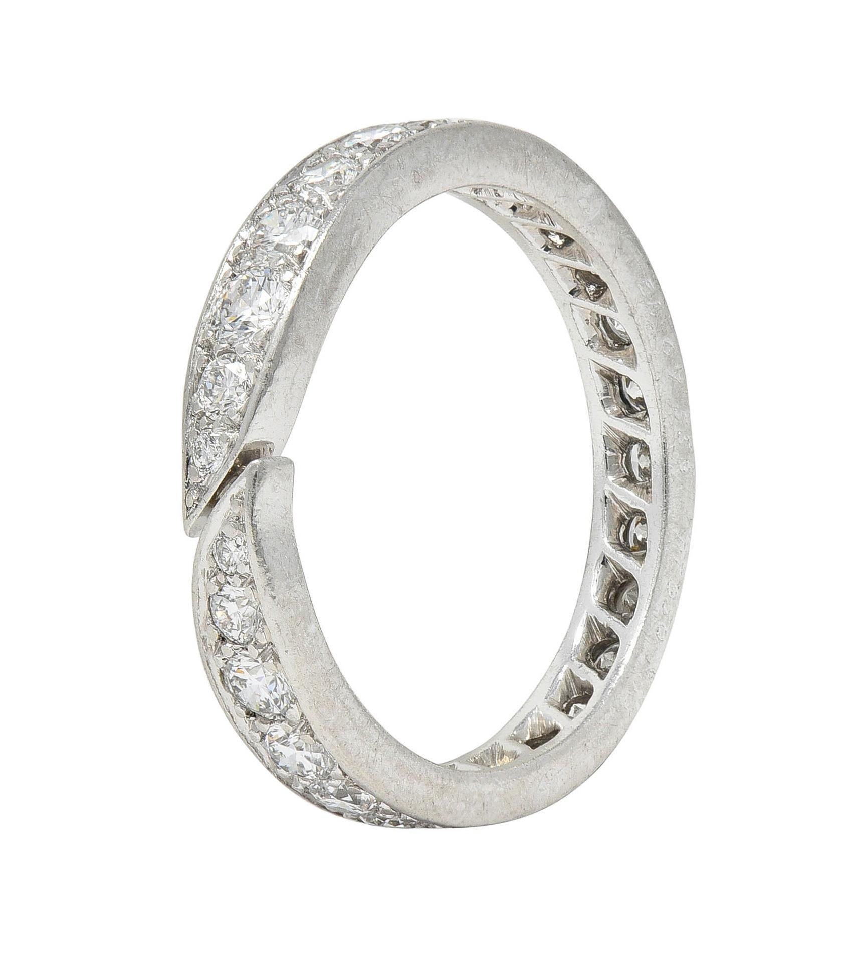 Designed as a bypass-style band with tapered twist motif terminals
Bead set throughout with round brilliant cut diamonds
 Weighing approximately 1.50 carats total 
G/H color with VS2 clarity
Stamped with French hallmarks for platinum
Numbered and