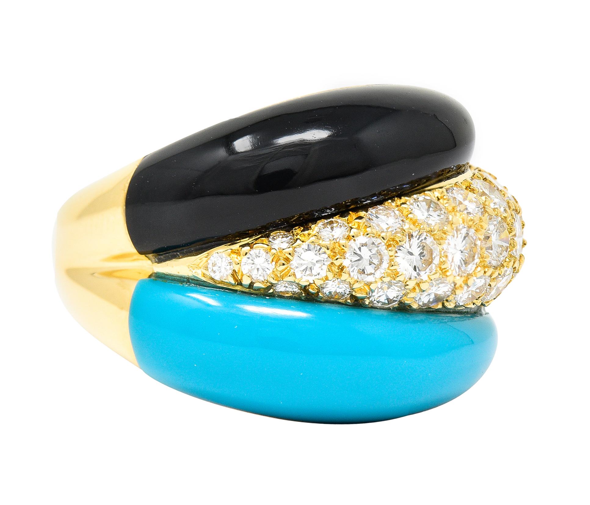 Designed as a segmented bombé style ring centering round brilliant cut diamonds. Pavé set and weighing 1.51 carats total - G/H in color with VS clarity. Flanked by carved tapered turquoise and onyx cabochons. Turquoise is opaque robin's egg blue in