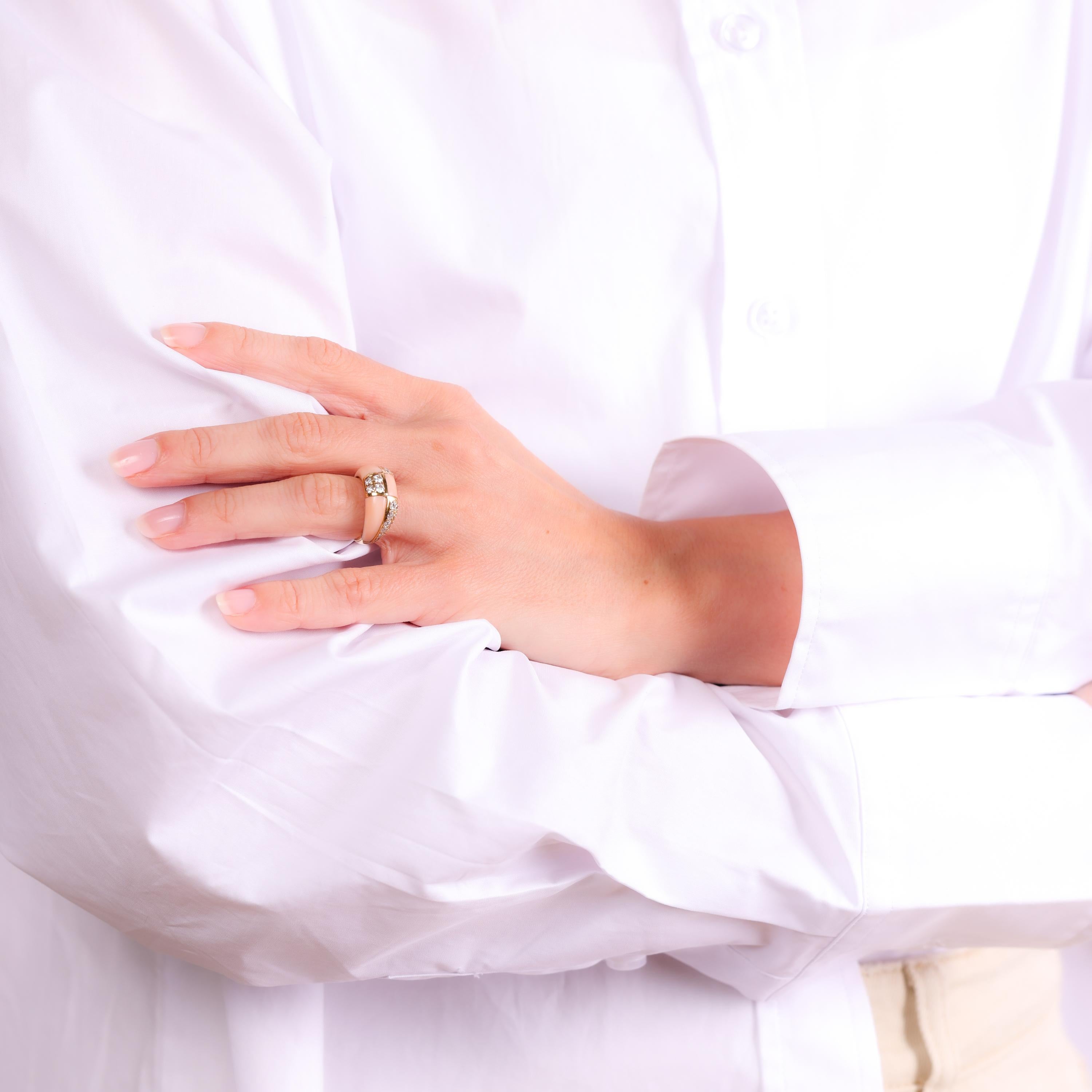 This vintage Van Cleef & Arpels ring showcases radiant diamonds paired with soft pink coral, all set in luxurious 18k yellow gold. A timeless and elegant piece from the 1980s.

Brand: Van Cleef & Arpels
Center stone: 30 round brilliant cut diamonds