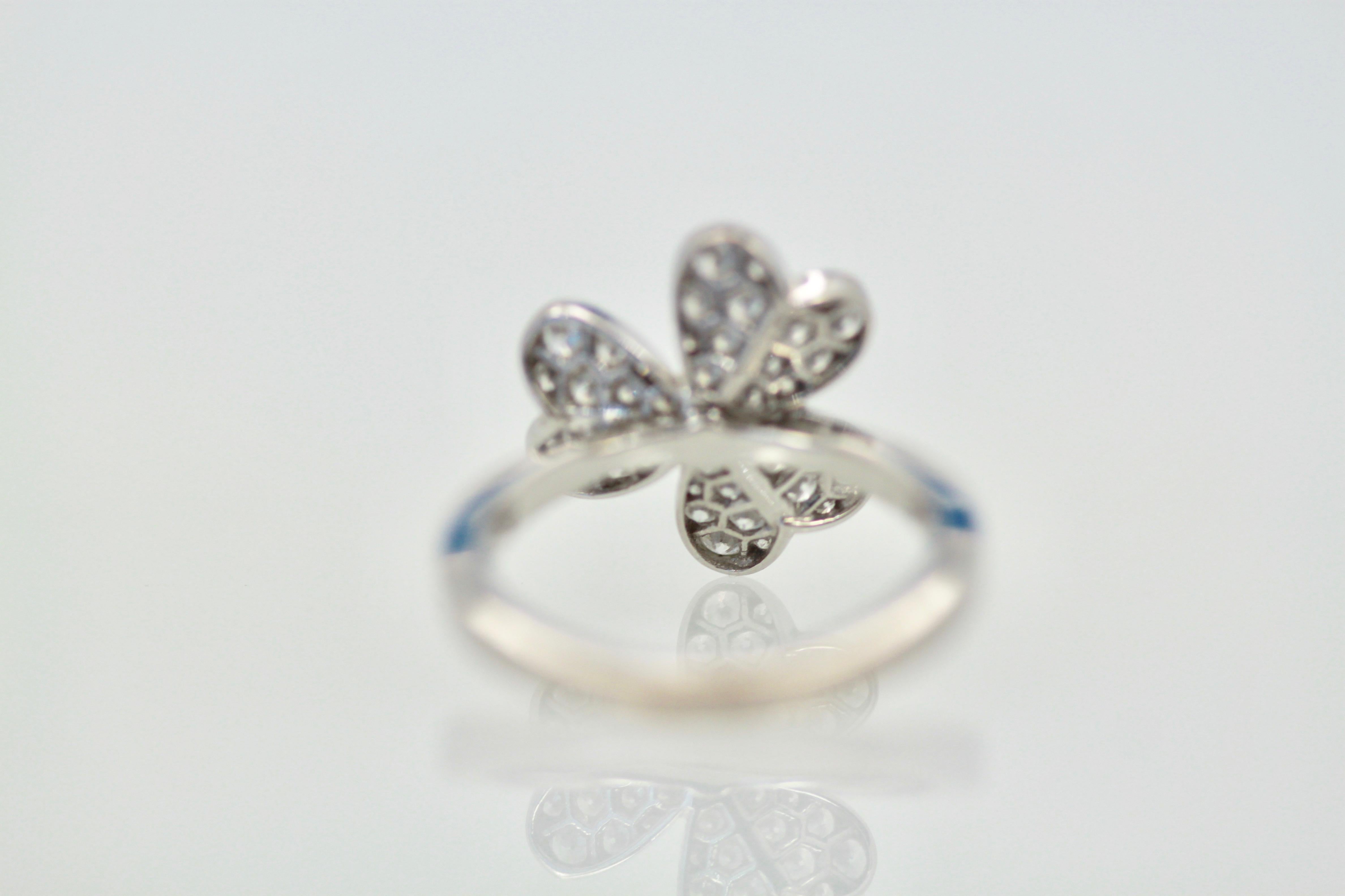 This Frivole Ring is the single flower ring it is signed numbered and comes with it's original box.  The size is 1.51 cm in diameter weights 5.08 grams and is size 54 US 6.5.  This Frivole ring is like petals in the wind delicate and lovely.