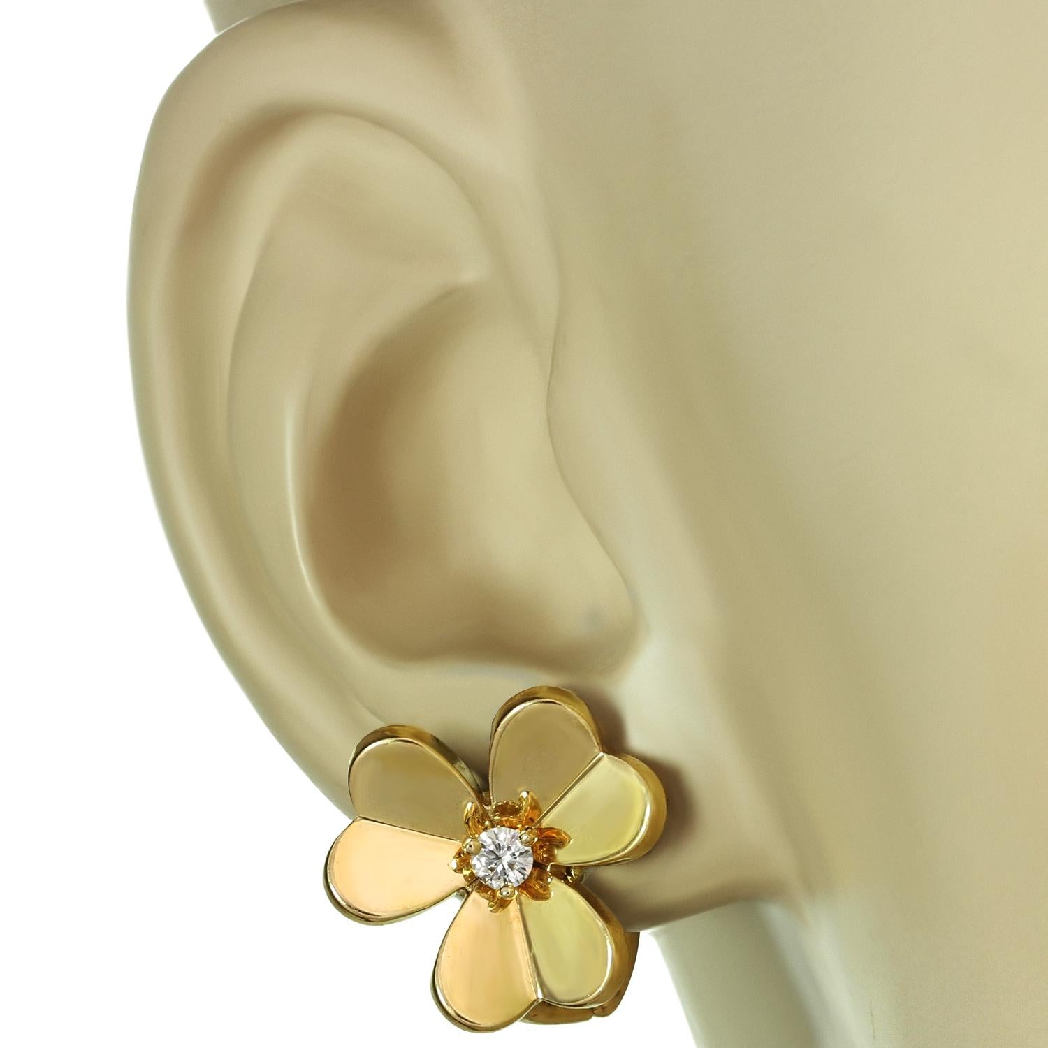 This elegant Van Cleef and Arpels clip-on earrings from the iconic Frivole collection features a flower design crafted in 18k yellow gold and set with 2 round brilliant D-E-F VVS1-VVS2 diamonds weighing an estimated 0.17 carats. This is the small