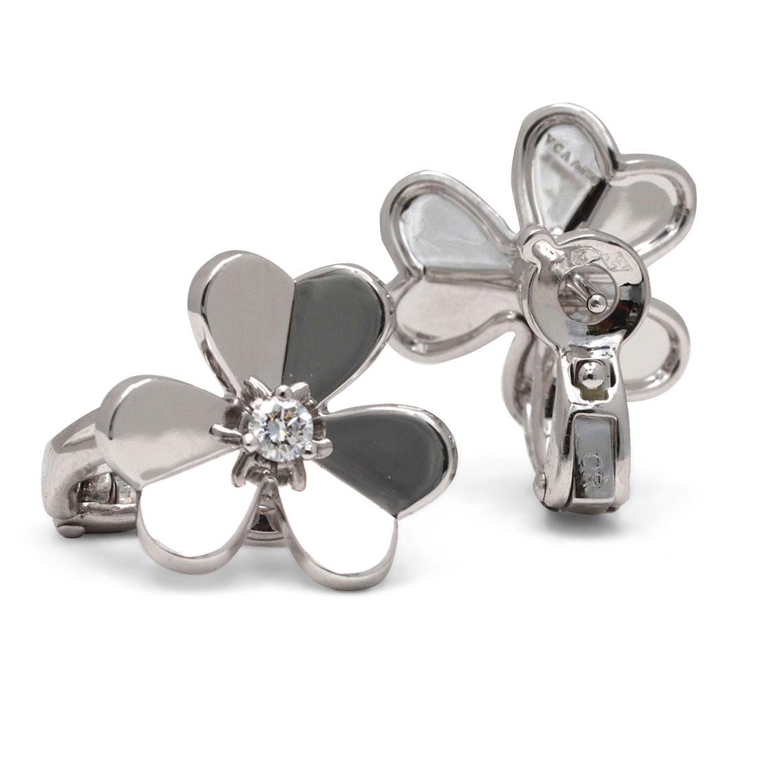 Authentic Van Cleef & Arpels 'Frivole' earrings feature mirror-polished 18 karat white gold heart-shaped petals set with a round brilliant cut diamond at the center (0.17 carats total, E-F color, VS clarity). Signed VCA, Au750, with serial number