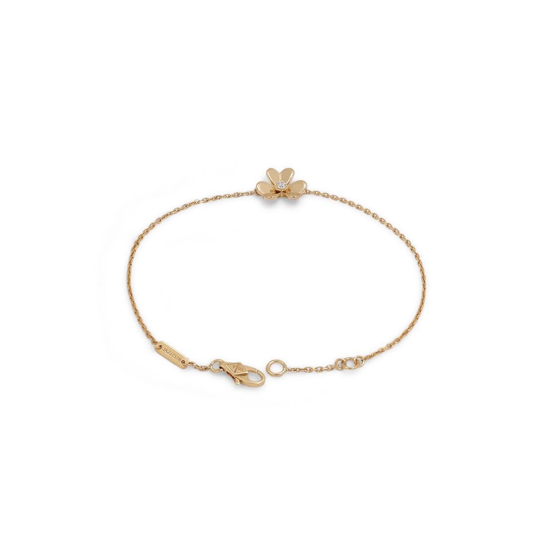 Authentic Van Cleef & Arpels 'Frivole' bracelet crafted in mirror-polished 18 karat yellow gold and set with a single round brilliant cut diamond at the center weighing approximately .05 carats. Signed VCA, 740, with serial number. Will fit up to a