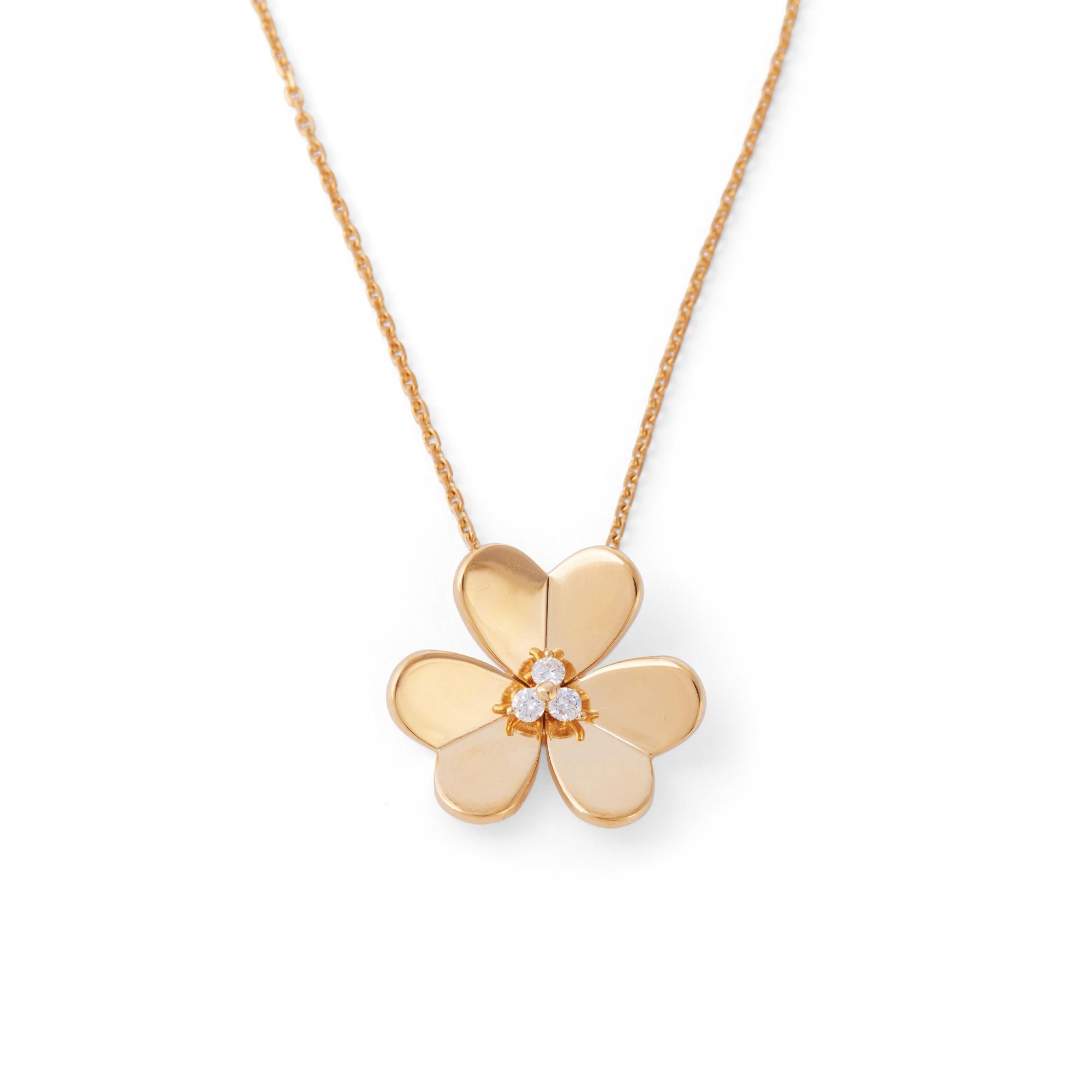 Authentic Van Cleef & Arpels 'Frivole' pendant necklace crafted in mirror-polished 18 karat yellow gold and set with an estimated 0.16 carats of round brilliant cut diamonds (E-F, VS) at the center. Signed VCA, 750, with serial number. The