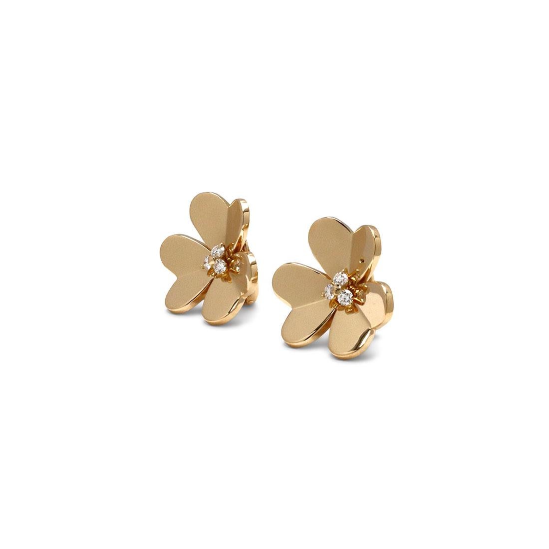 Authentic Van Cleef & Arpels 'Frivole' earrings feature mirror-polished 18 karat yellow gold heart-shaped petals set with three round brilliant cut diamonds at the center for an estimated 0.32 carats total weight. Signed VCA, 750, with serial number