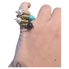 VAN CLEEF & ARPELS Georges Lenfant 18k, coppia di anelli con perle, turchesi e lapis
