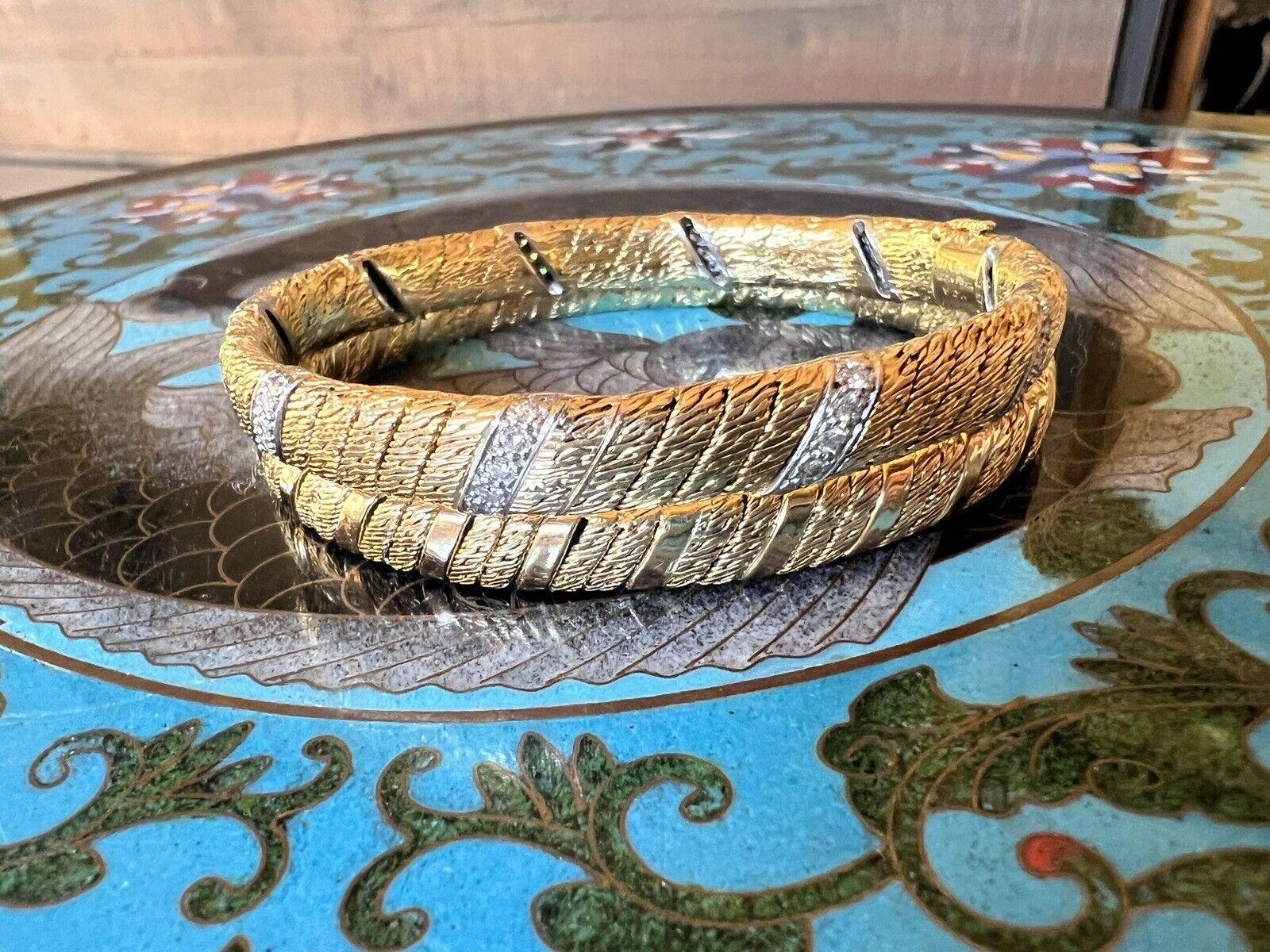 Van Cleef & Arpels Paris by Georges Lenfant 18k Yellow Gold & Diamond Pair of Bangles Vintage Circa 1970s

Here is your chance to purchase a beautiful and highly collectible designer pair of bangle bracelets.  

Made in the 1970s by Georges Lenfant