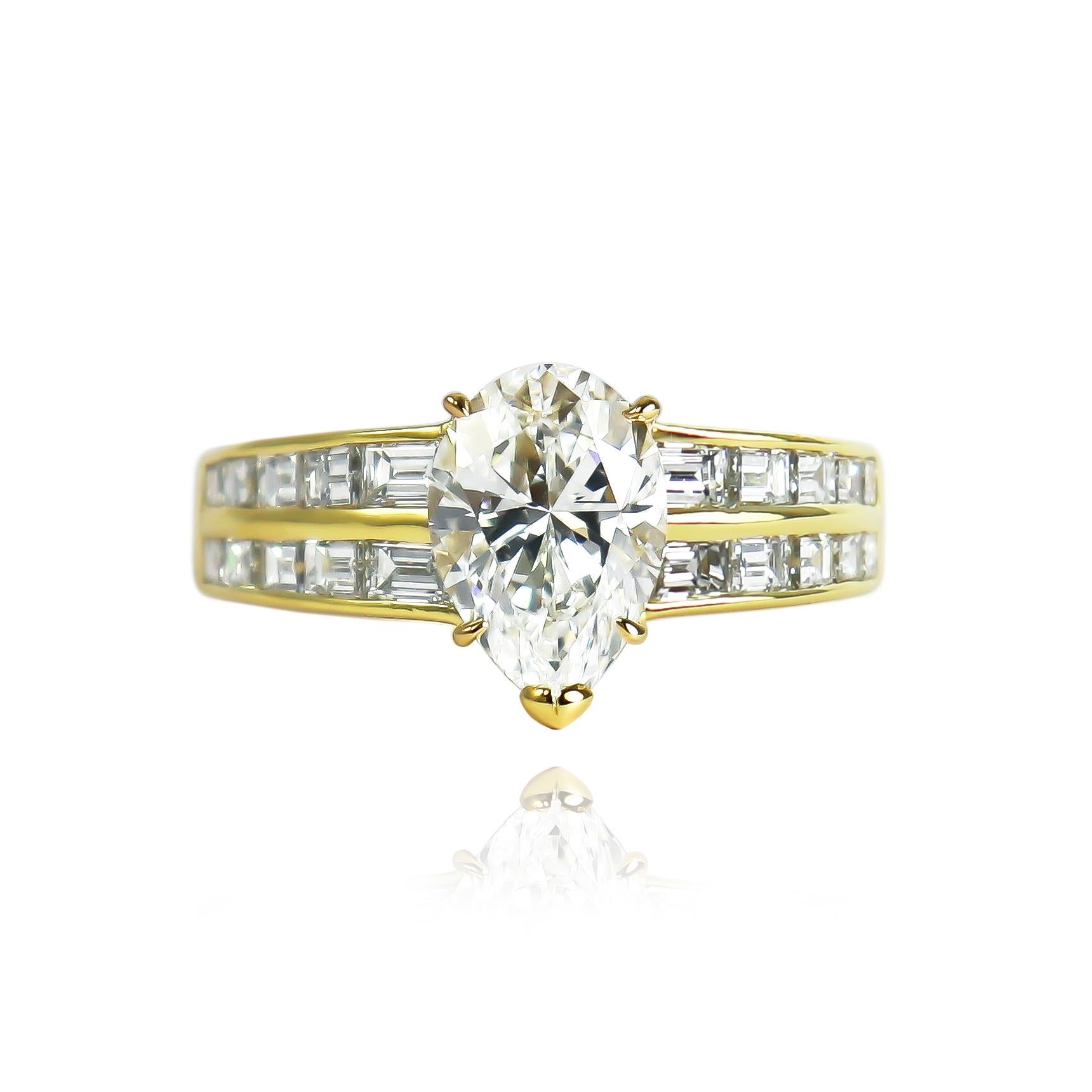 This exceptional ring from the house of Van Cleef and Arpels features a GIA certified 2.00 carat pear modified brilliant cut diamond of E color and VS1 clarity. Set in a 18K yellow gold setting with 20 straight baguettes, this scintillating piece is