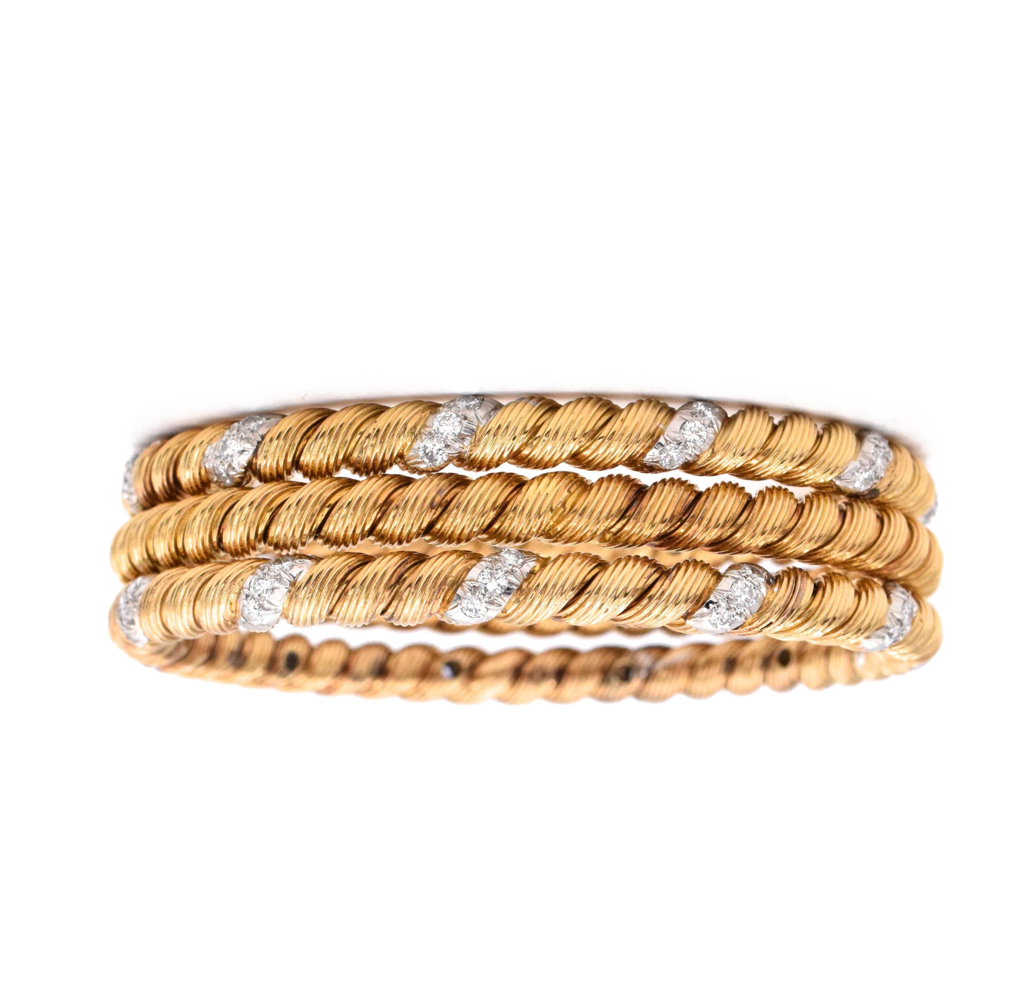 Beautiful twisted style Gold and Diamond Bangles by 
Van Cleef and Arpels. Two  bangles with diamonds & one plain. gold.
 18k yellow gold. 
Signed VCA, FRANCE. 
Size: Medium - Inner diameter is 2.5 inches Inner circumference is 7 inches