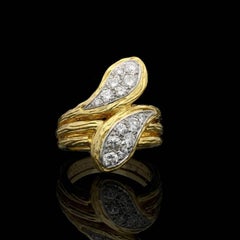 Van Cleef & Arpels Gold and Diamond Double Headed Snake Ring, circa 1970s