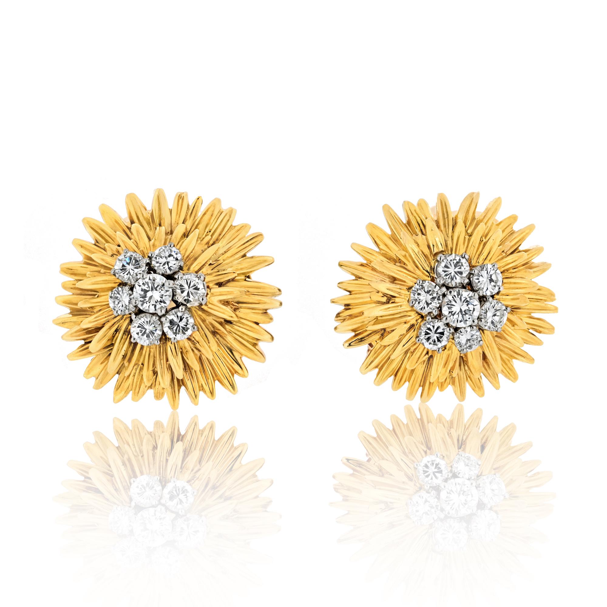 Van Cleef & Arpels 18k gold and diamond flower earrings. Centers of the earrings set with 14 round brilliant cut diamonds with total weight of
approximately 1.60 carats .Surrounded by two rows of carved yellow gold petals. Equipped with french