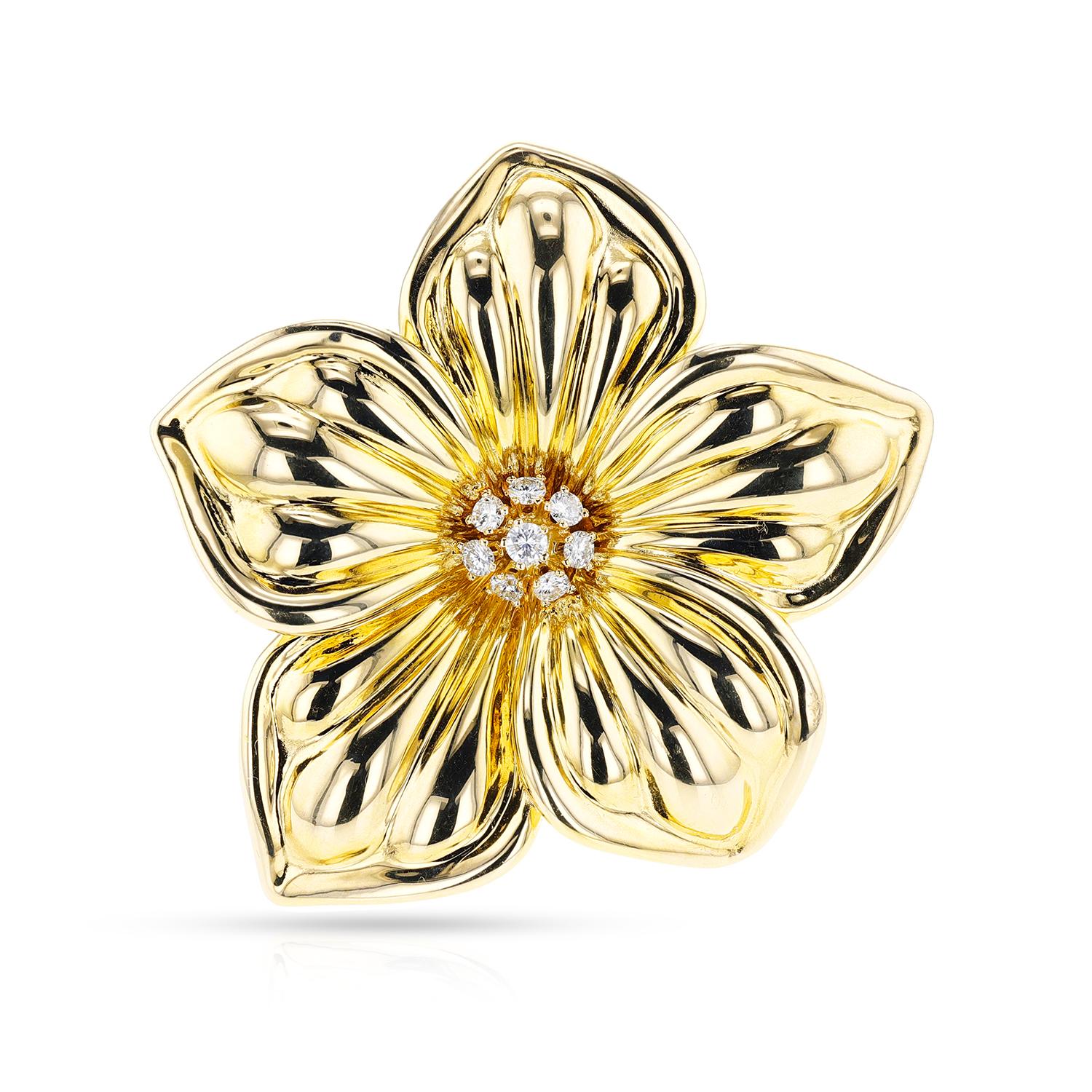 This exquisite Van Cleef & Arpels gold and diamond floral brooch features an intricate design with 18K gold leaves, stems and petals inlaid with shimmering diamonds. This sophisticated piece is perfect for the fashionista looking for an eye-catching
