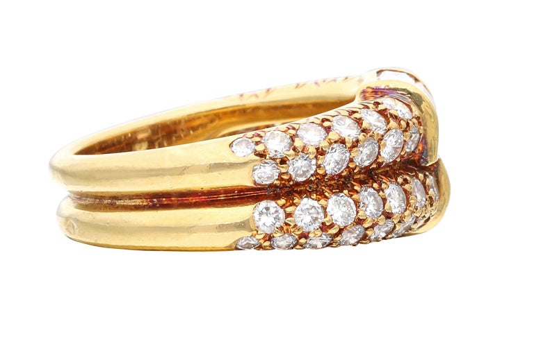 This stunning ring is centered with 6 baguette diamonds and accented by 54 pavé set round brilliant cut diamonds.

- Diamonds weighing a total of approximately 2.25 carats
- Signed VCA with serial number
- 18 karat yellow gold
- Total weight 7.59
