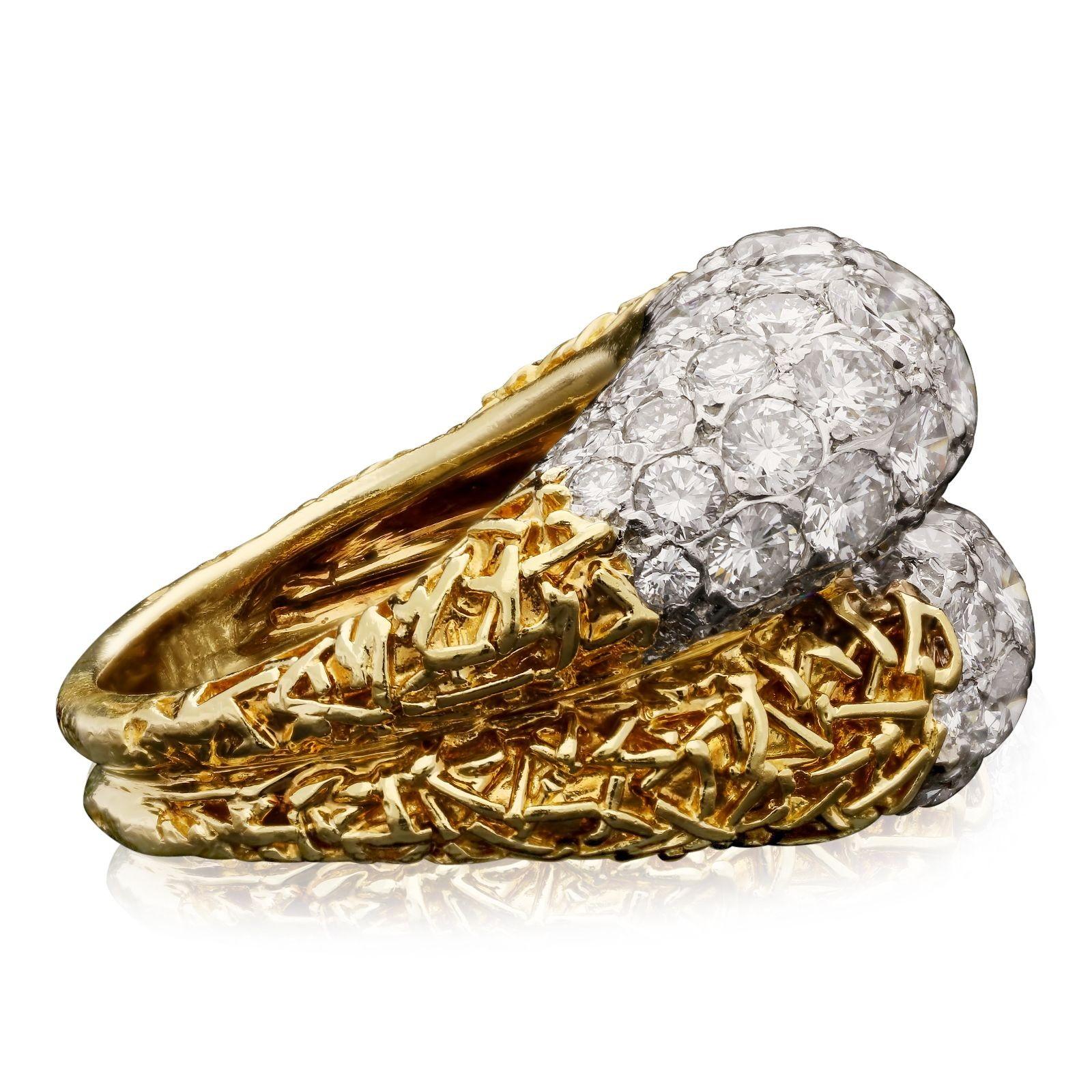 A stylish vintage gold and diamond cross over ring by Van Cleef & Arpels 1972, of asymmetric double bombe form in heavily textured 18ct yellow gold the front of each domed row pavé set in platinum with round brilliant diamonds of varying sizes,