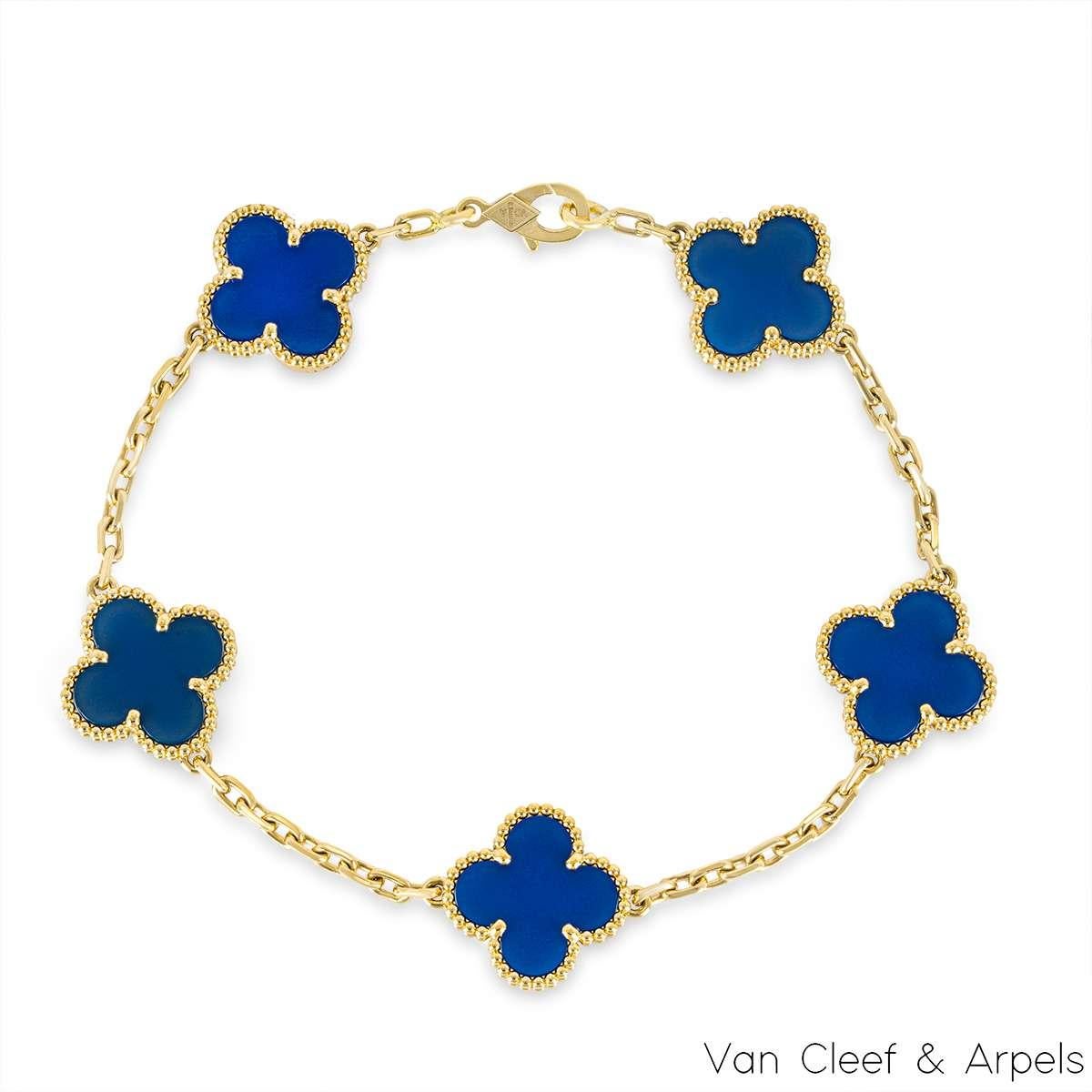 An 18k yellow gold blue agate bracelet from the Vintage Alhambra collection by Van Cleef and Arpels. The bracelet is made up of 5 of the iconic clover motifs, each set with a beaded edge and a blue agate inlay. The bracelet measures 7.5 inches,