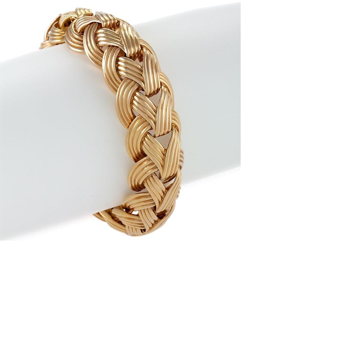 An 18 karat gold bracelet by Van Cleef & Arpels. The bracelet is composed of domed braided ribbed links.  The bracelet measures 8