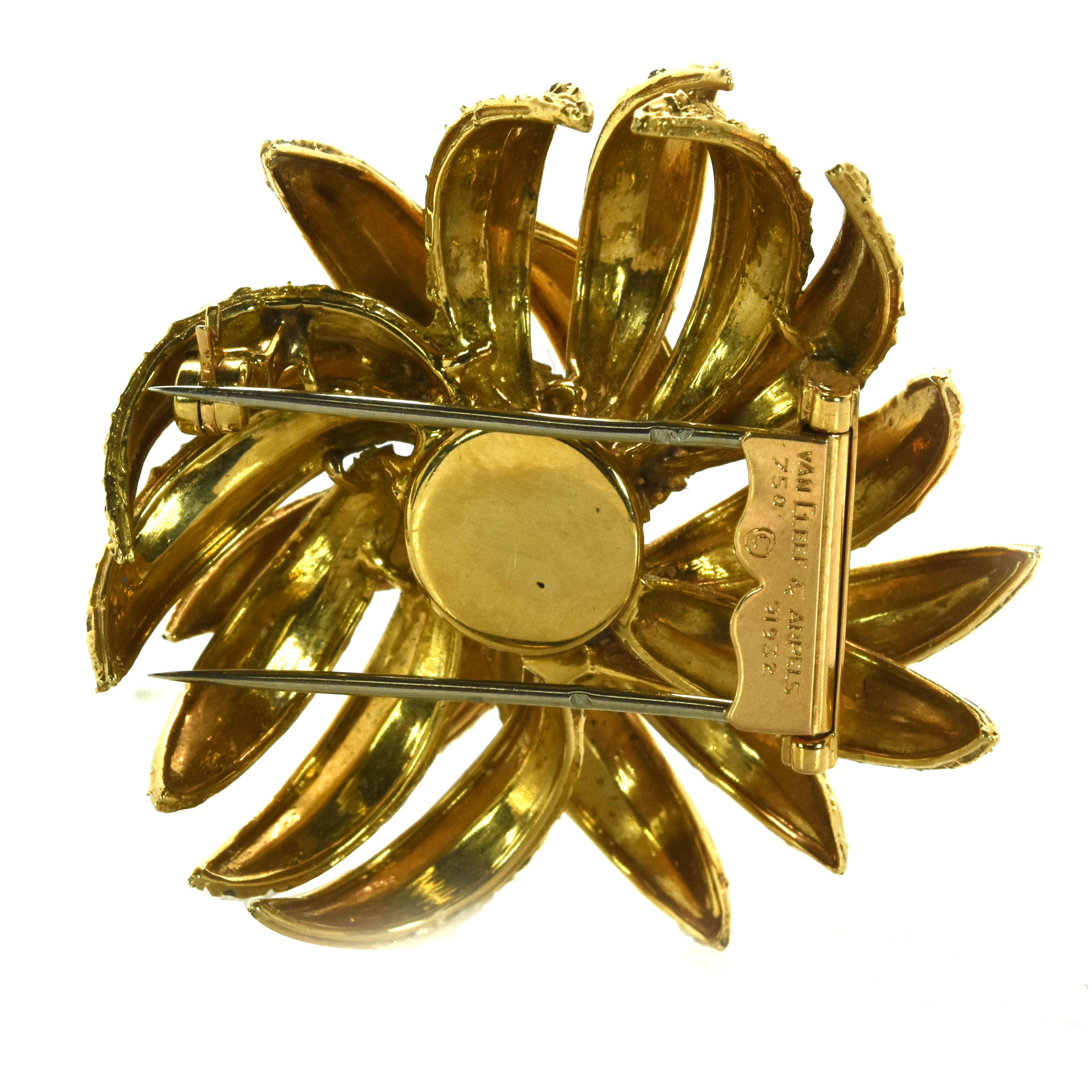 A yellow gold brooch by Van Cleef & Arpels. The brooch is made in 18k yellow gold and weighs 14.9dwts. The brooch is signed and numbered by Van Cleef and bears French Hallmarks