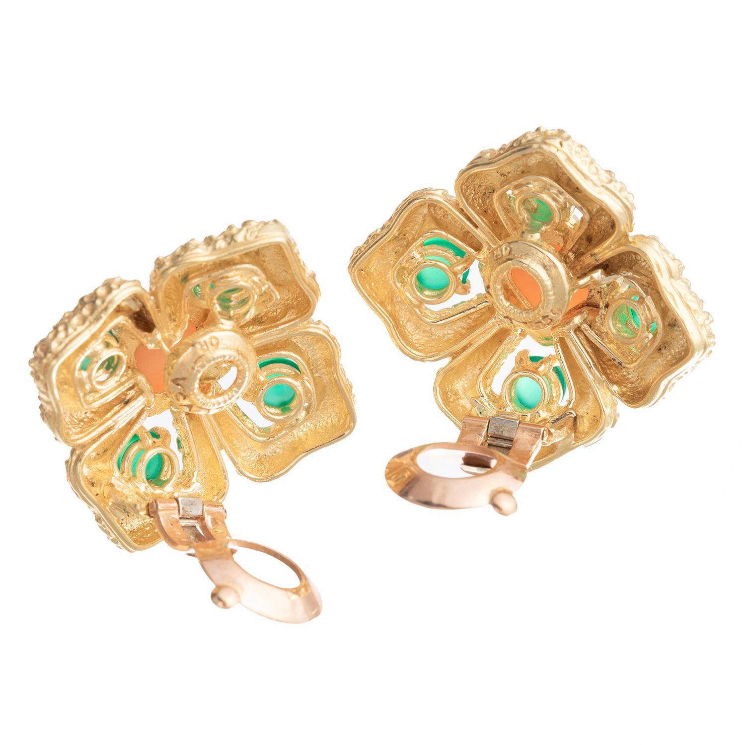 Van Cleef & Arpels 1970s Delphes clip earrings in textured 18k yellow gold, centering a sugarloaf cabochon angel skin coral surrounded by four oval cabochon chrysoprase.  Signed 